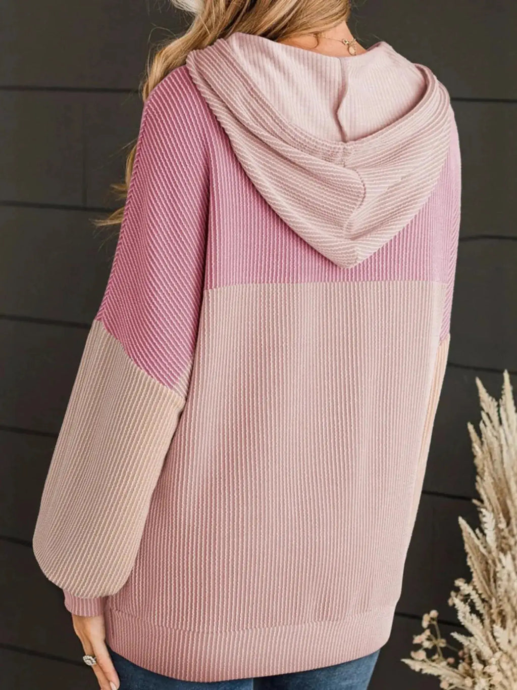 Drawstring color-block knit hoodie top in pink tones with ribbed texture and long sleeves