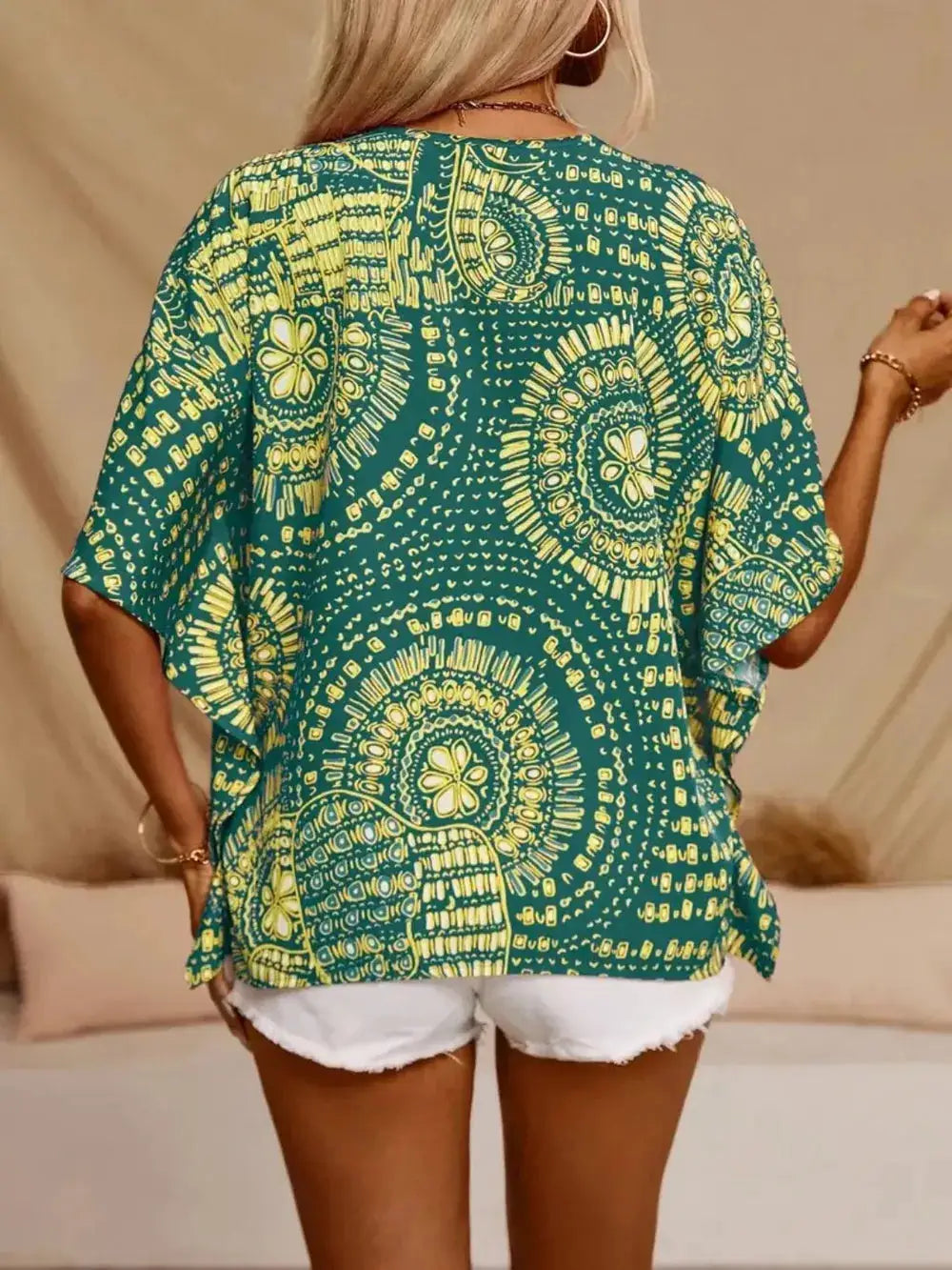 Printed V-Neck Half Sleeve Top in teal with yellow mandala print, sheer lightweight fabric.