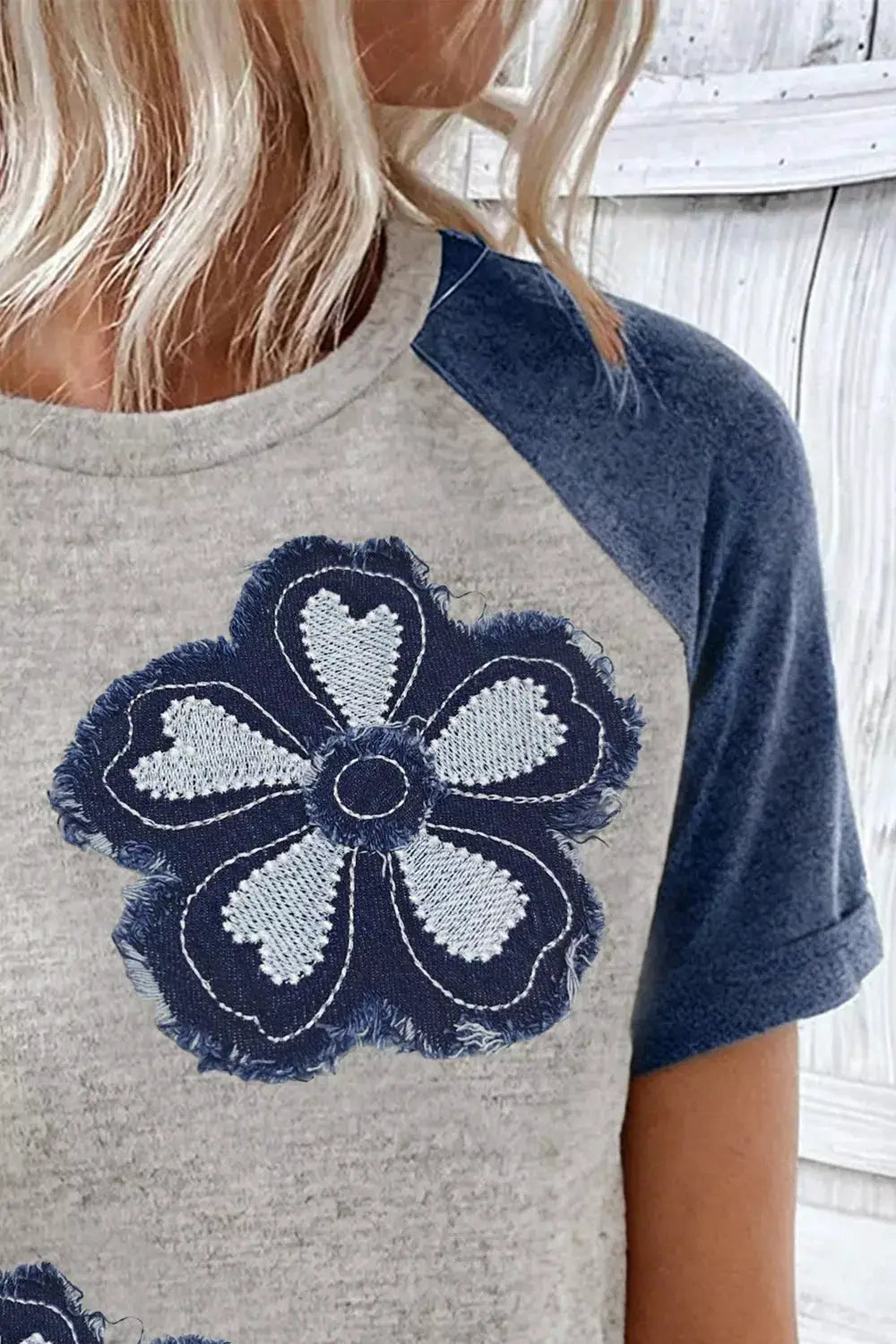 Floral Raglan Sleeve T-Shirt with frayed-edge denim flower applique on gray body and blue sleeves