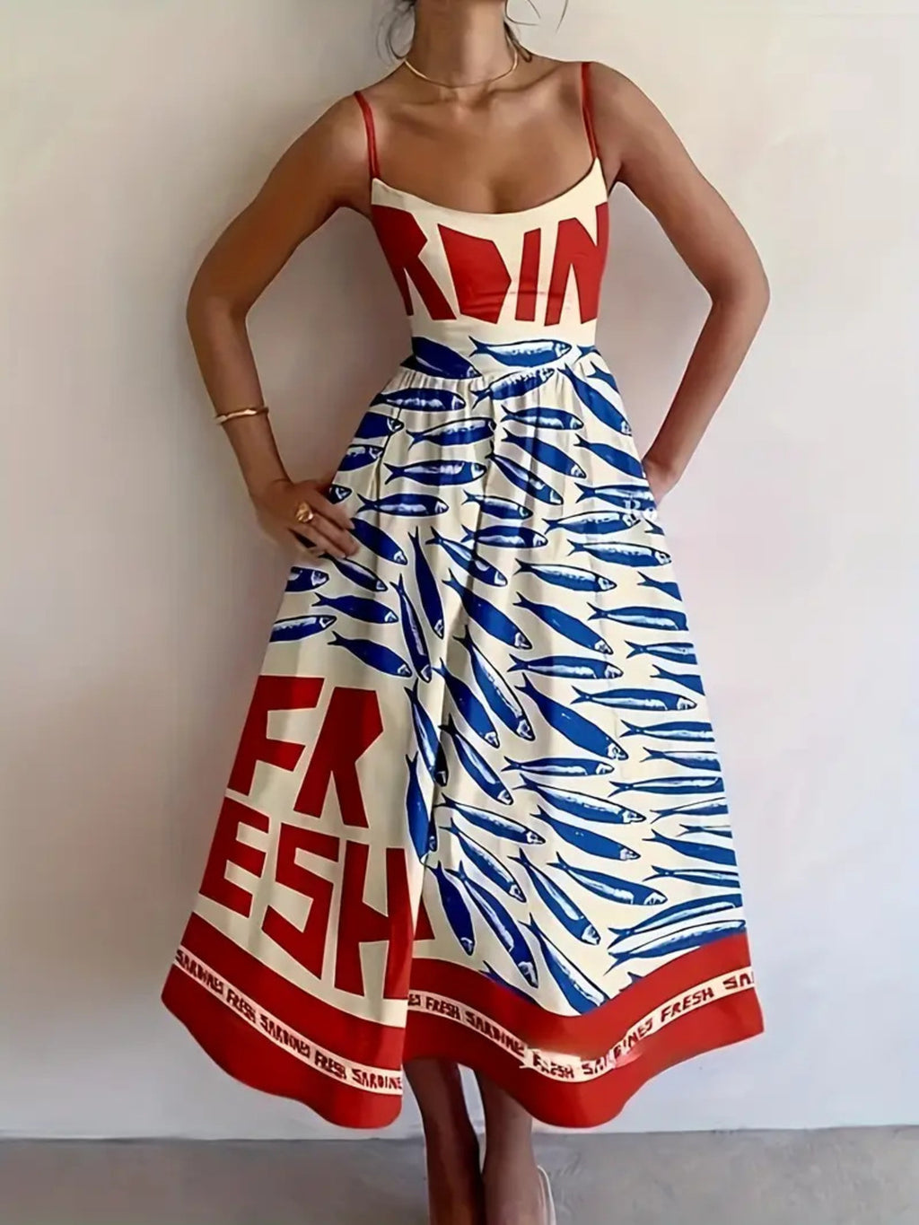 Sardine Print Spaghetti Strap Midi Dress in white with blue fish print and red border hem; thin red straps
