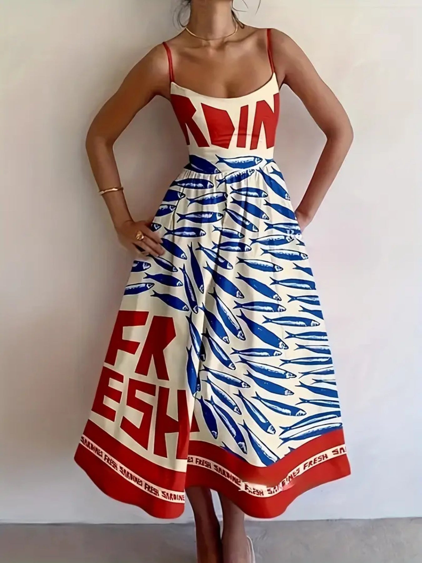 Sardine Print Spaghetti Strap Midi Dress in white with blue fish print and red border hem; thin red straps