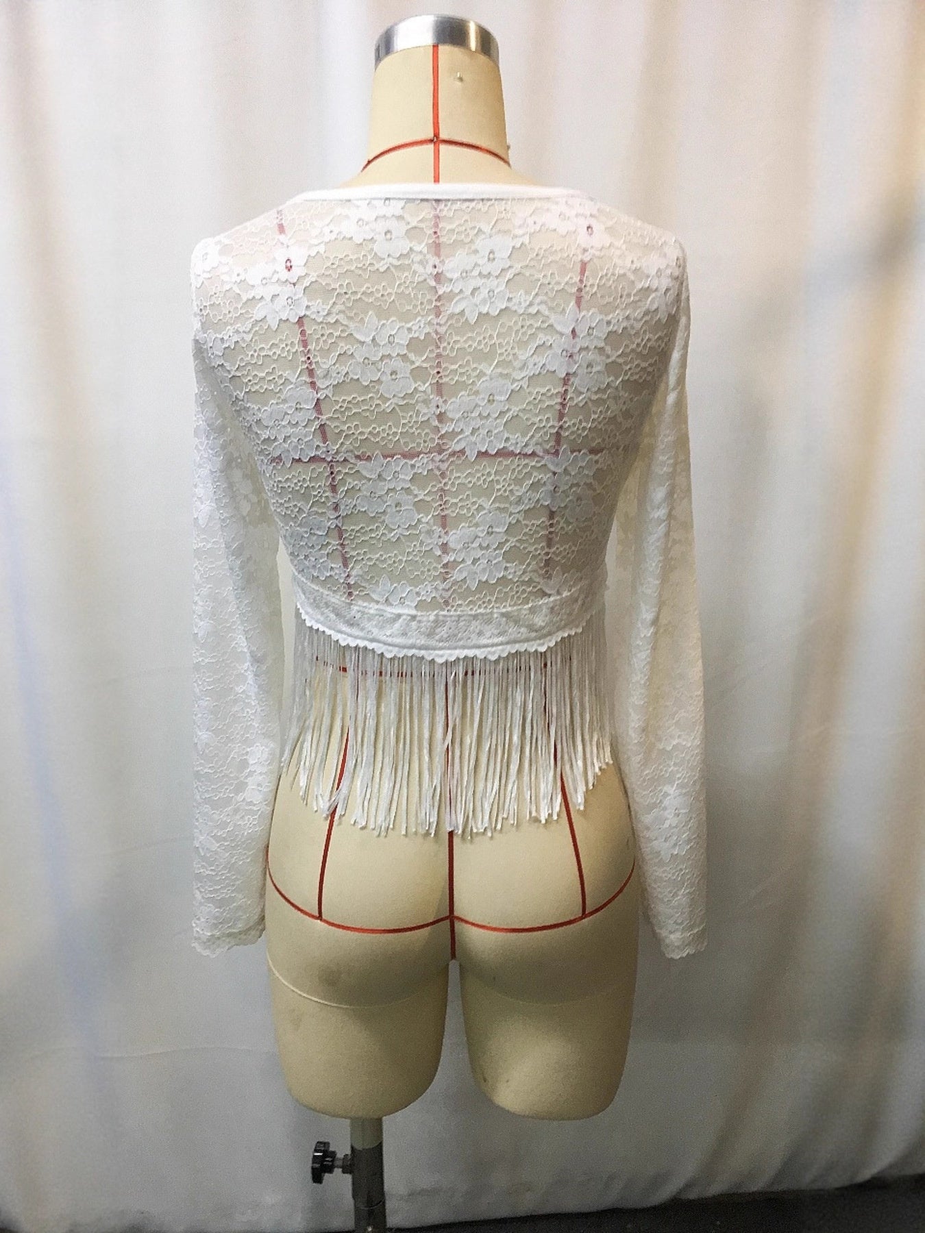 Plus-size white lace long-sleeve top with fringe hem by Trendsi