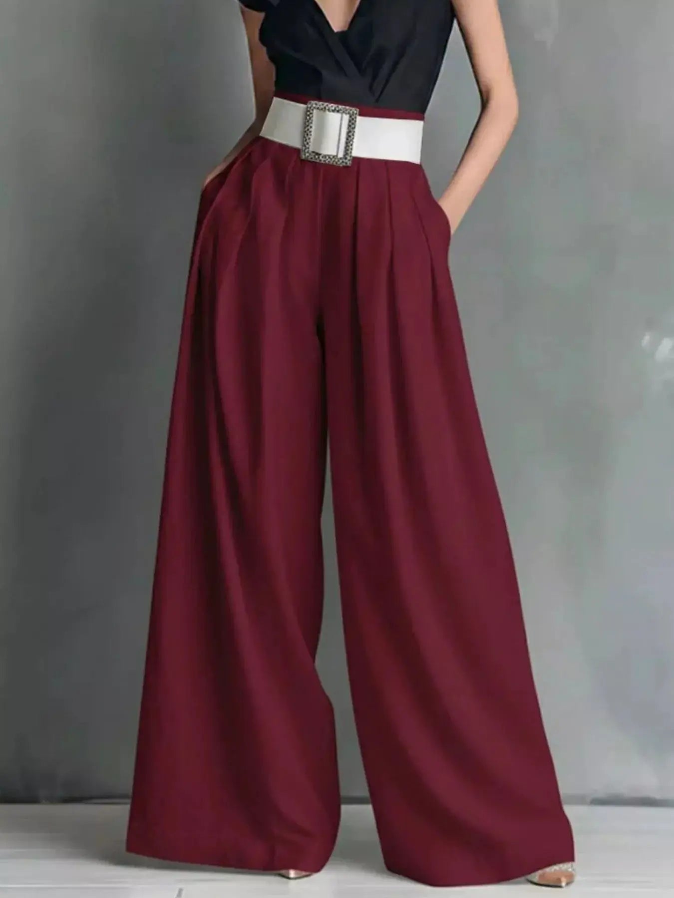 High-Waisted Wide-Leg Pants in burgundy with a white belt and square buckle.