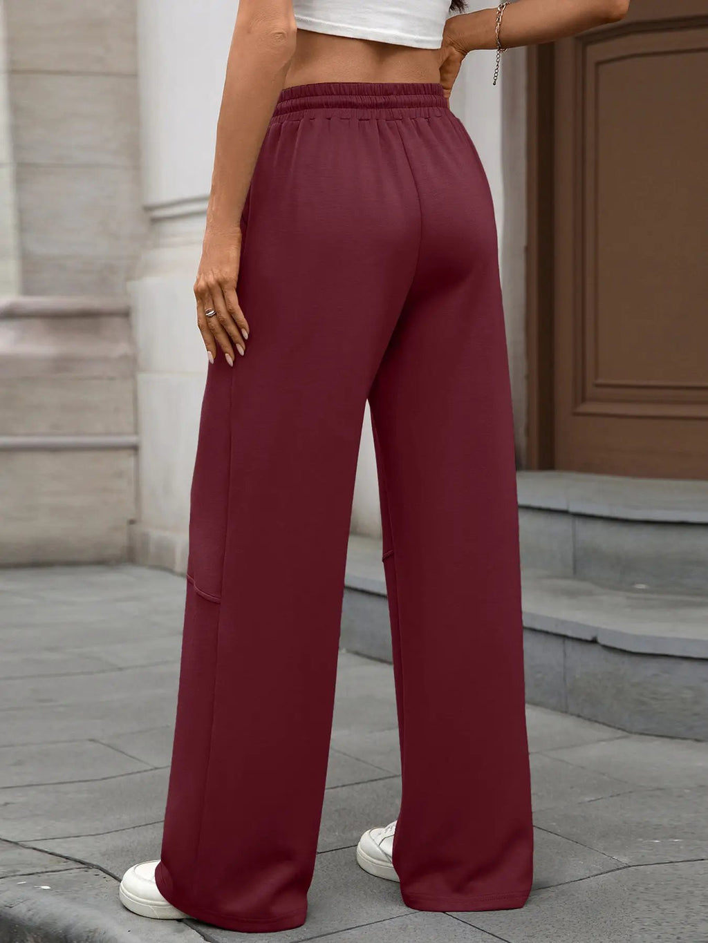 Drawstring high-waist wide-leg casual pants in burgundy with elastic waistband.
