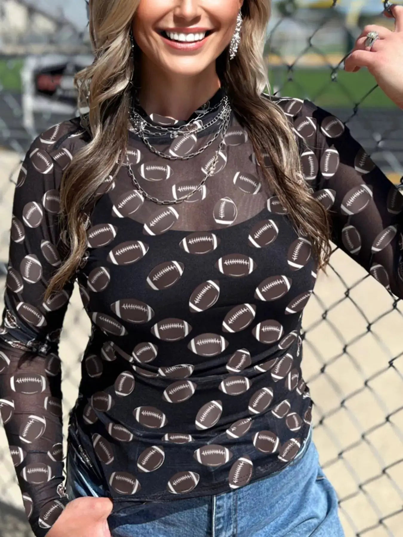 Game Day Mesh Sheer Long Sleeve Top in black with white football print.