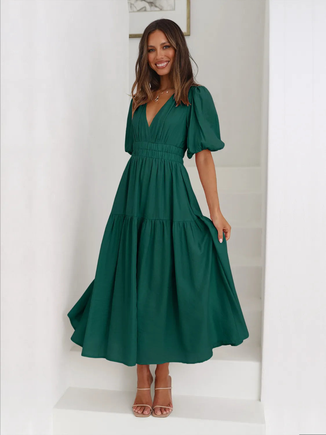 Tiered surplice half-sleeve midi dress in emerald green with puff sleeves and smocked waist