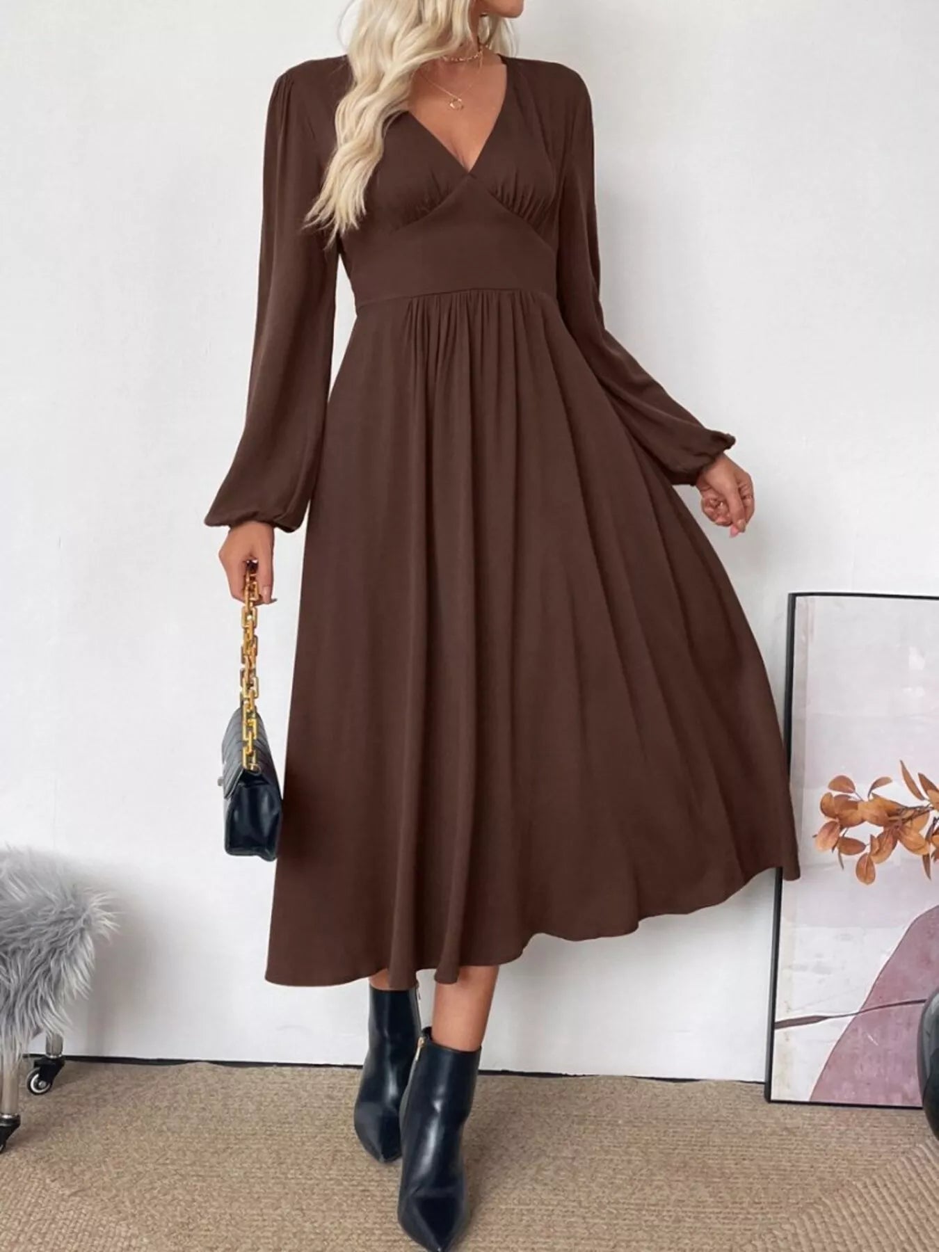 V-Neck Balloon Sleeve Midi Dress in brown with wrap bodice, long puff sleeves, and flowy A-line skirt by Trendsi.