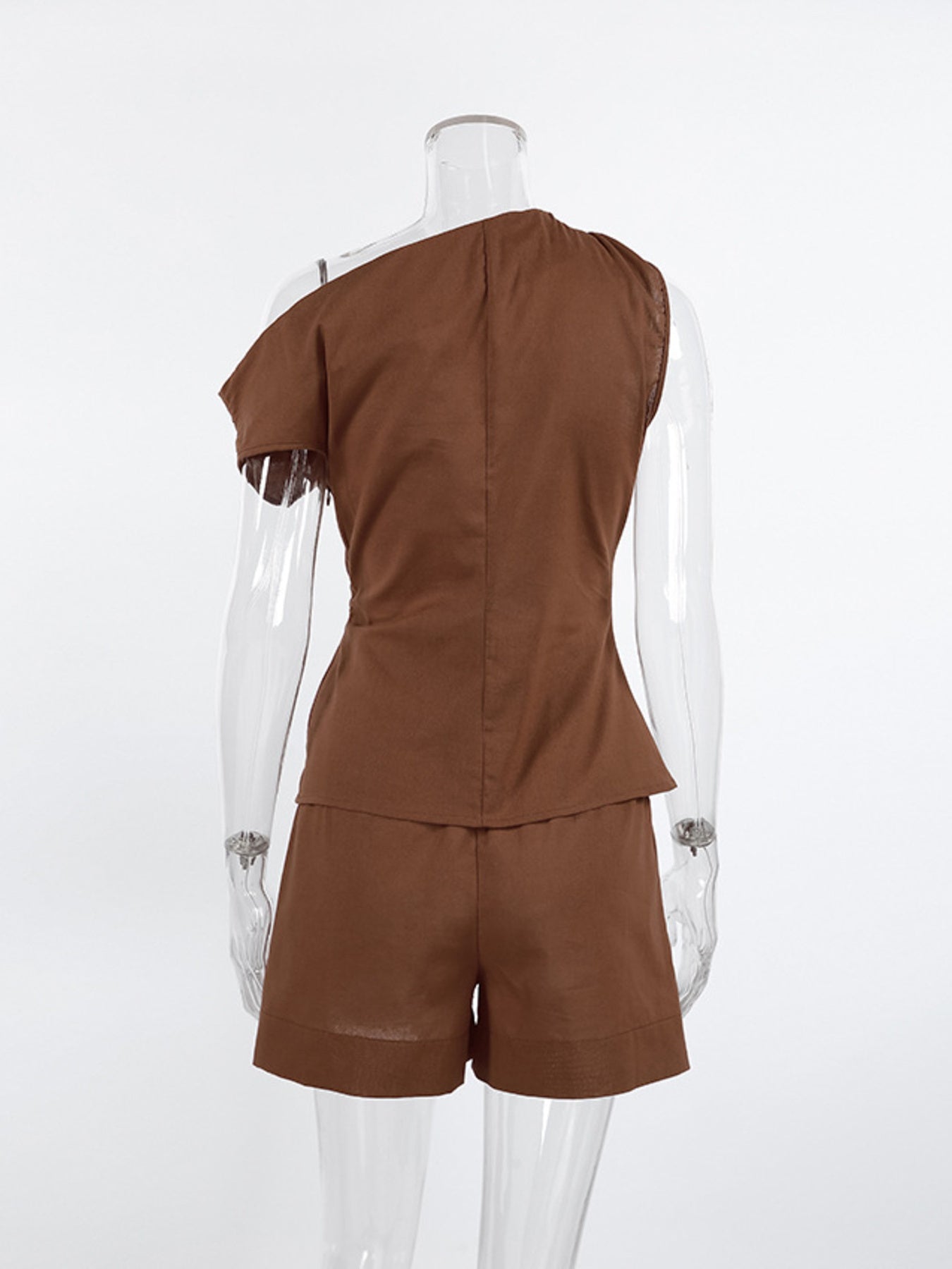 One-Shoulder Top and Shorts Set by Belle Bijouix in brown; ruched, asymmetrical design.