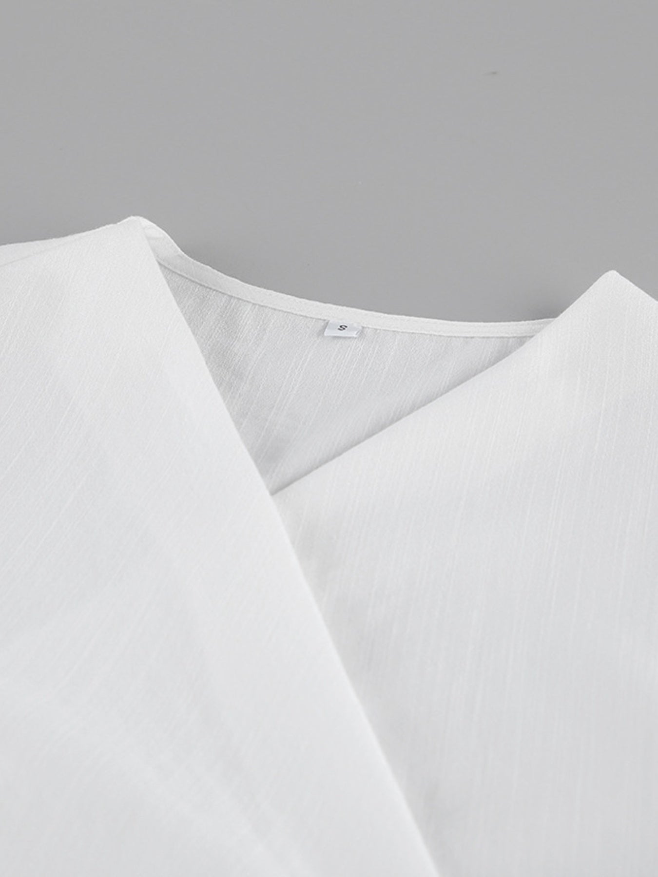 Wrap Top & Wide Leg Pants Set white fabric, collar detail, size S label visible.