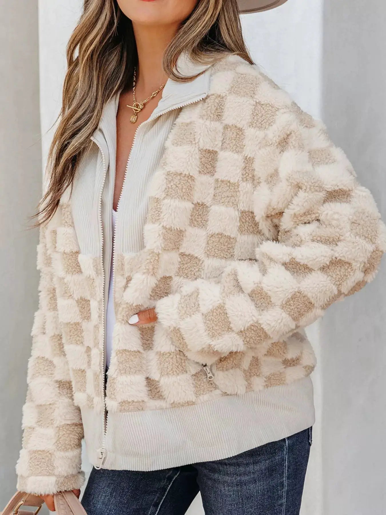 Checker sherpa corduroy patchwork zip-up jacket in cream and beige; pocketed with zip closures, worn by model