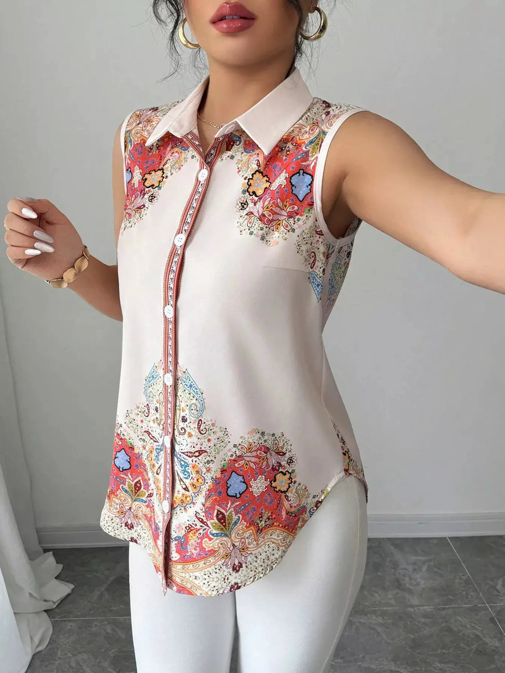 Button Up Sleeveless Shirt with cream base and vibrant paisley print, white collar