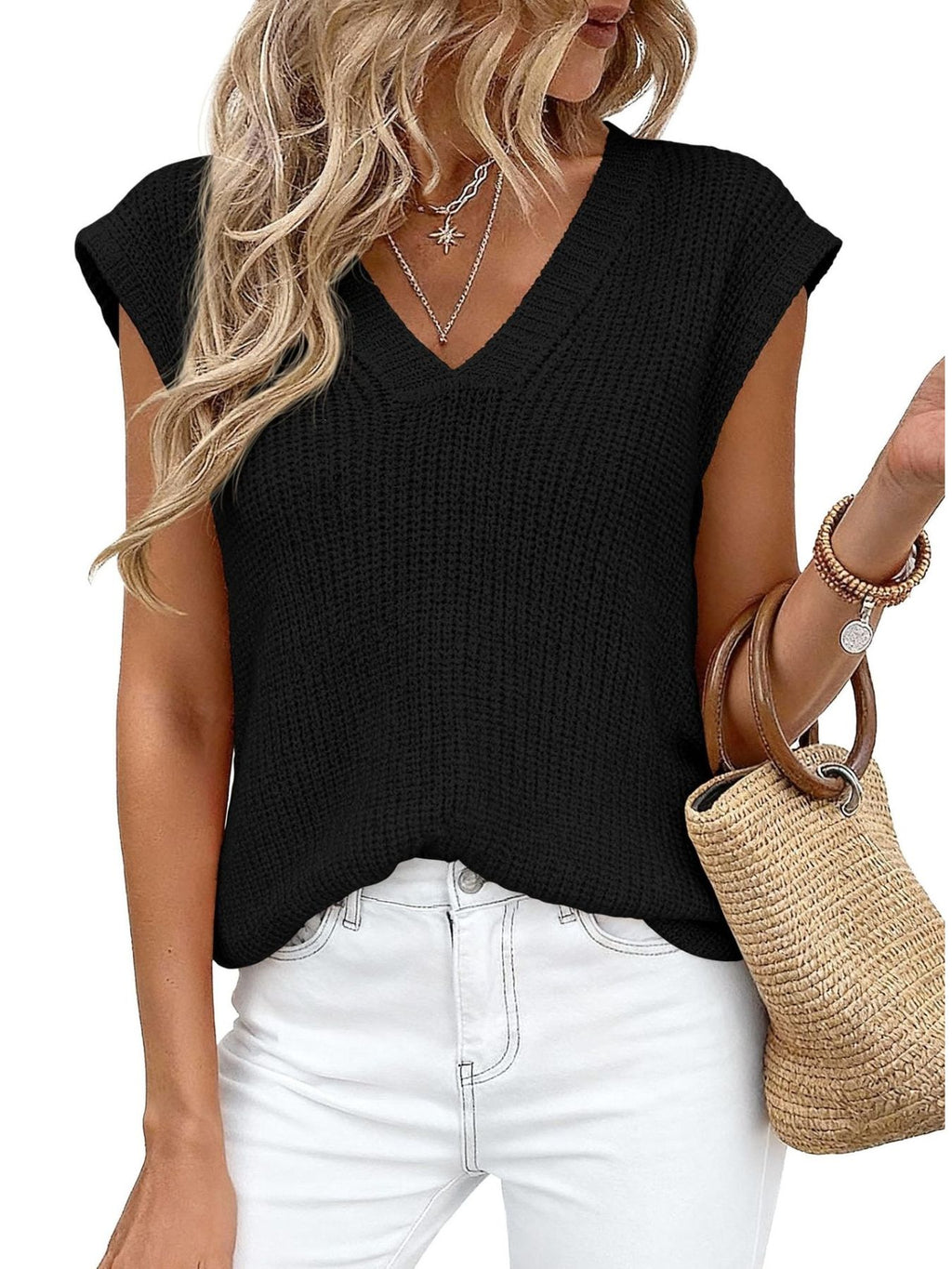 V-Neck Sweater Vest in black knit, sleeveless style paired with white jeans