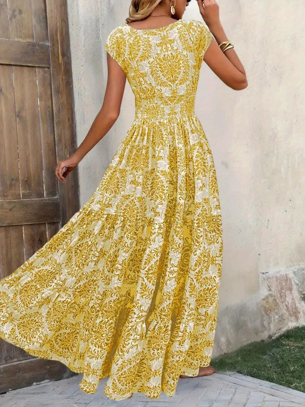 Printed Cap Sleeve Maxi Dress by Bellebijouix in yellow floral print; tiered, smocked waist, full-length flowing skirt.