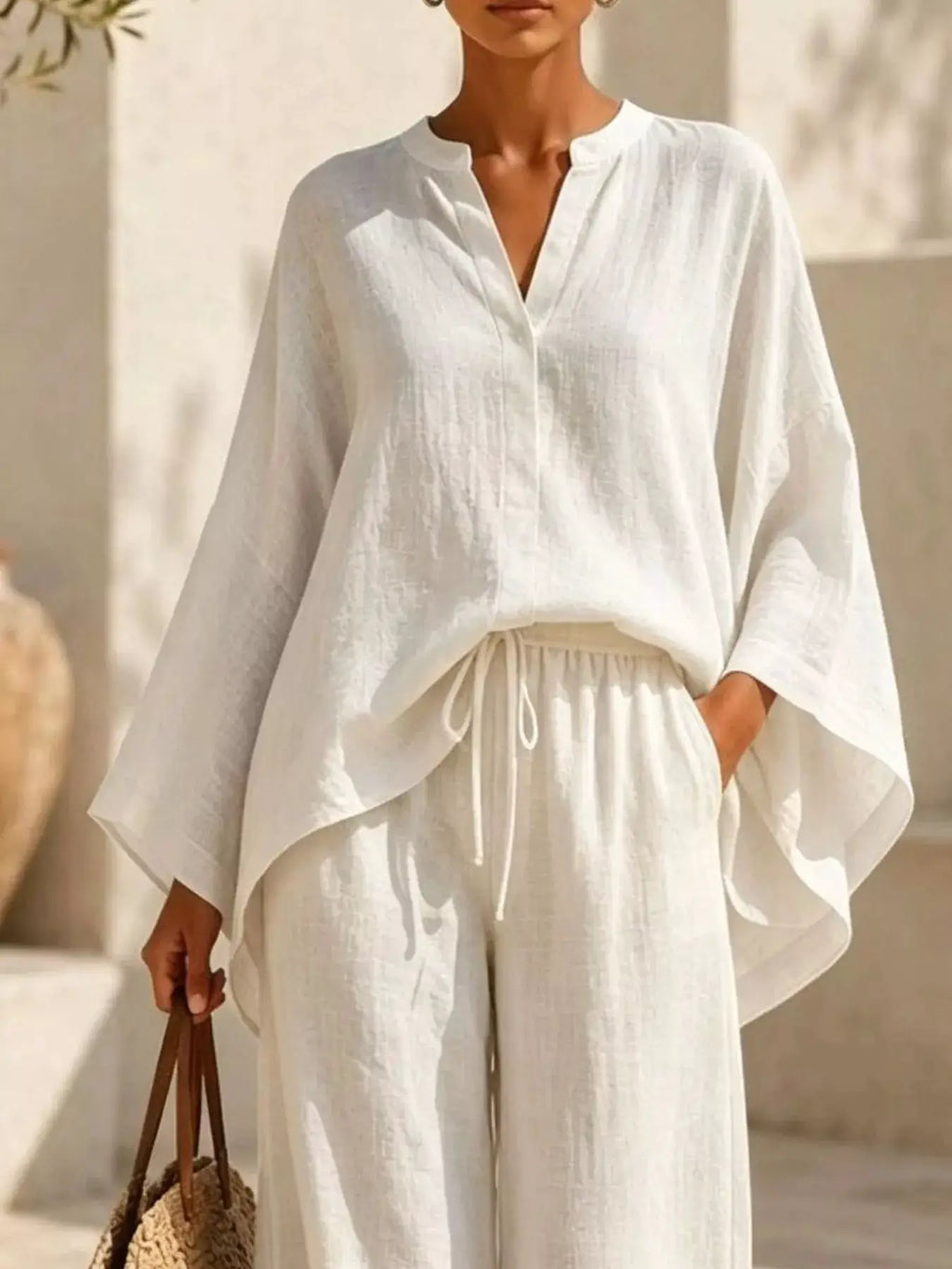 Plus Size Notched Long Sleeve Top & Wide Leg Pants Set by Belle Bijouix in ivory.