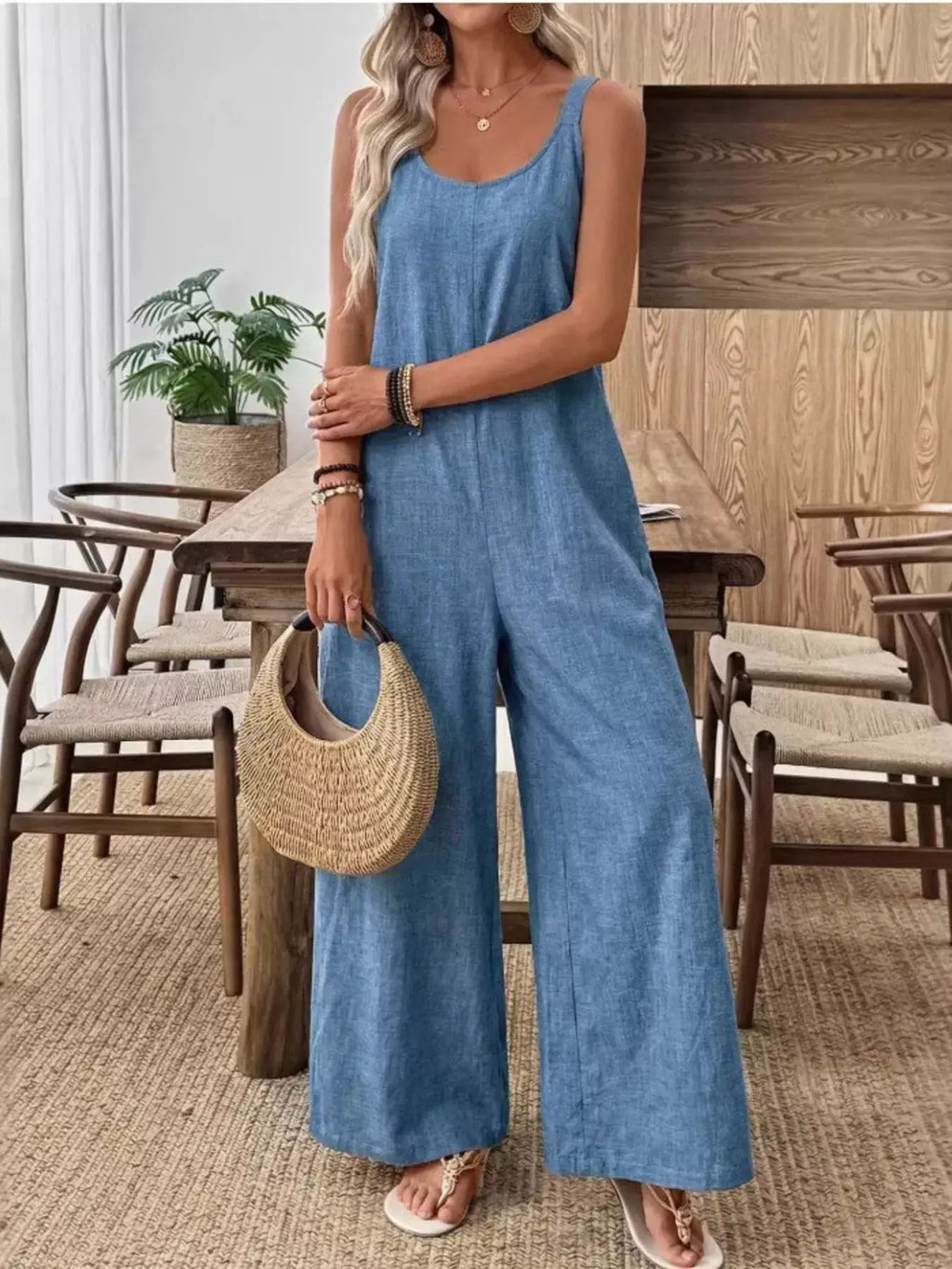Spaghetti Strap Wide-Leg Jumpsuit by Trendsi in blue denim, with straw handbag and sandals