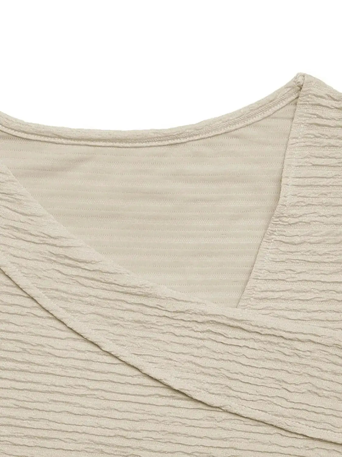 Asymmetrical Short Sleeve Top in cream crinkle fabric.