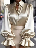 Satin Button Up Flounce Sleeve Shirt by Belle Bijouix in beige satin with button-down front and ruched detail.