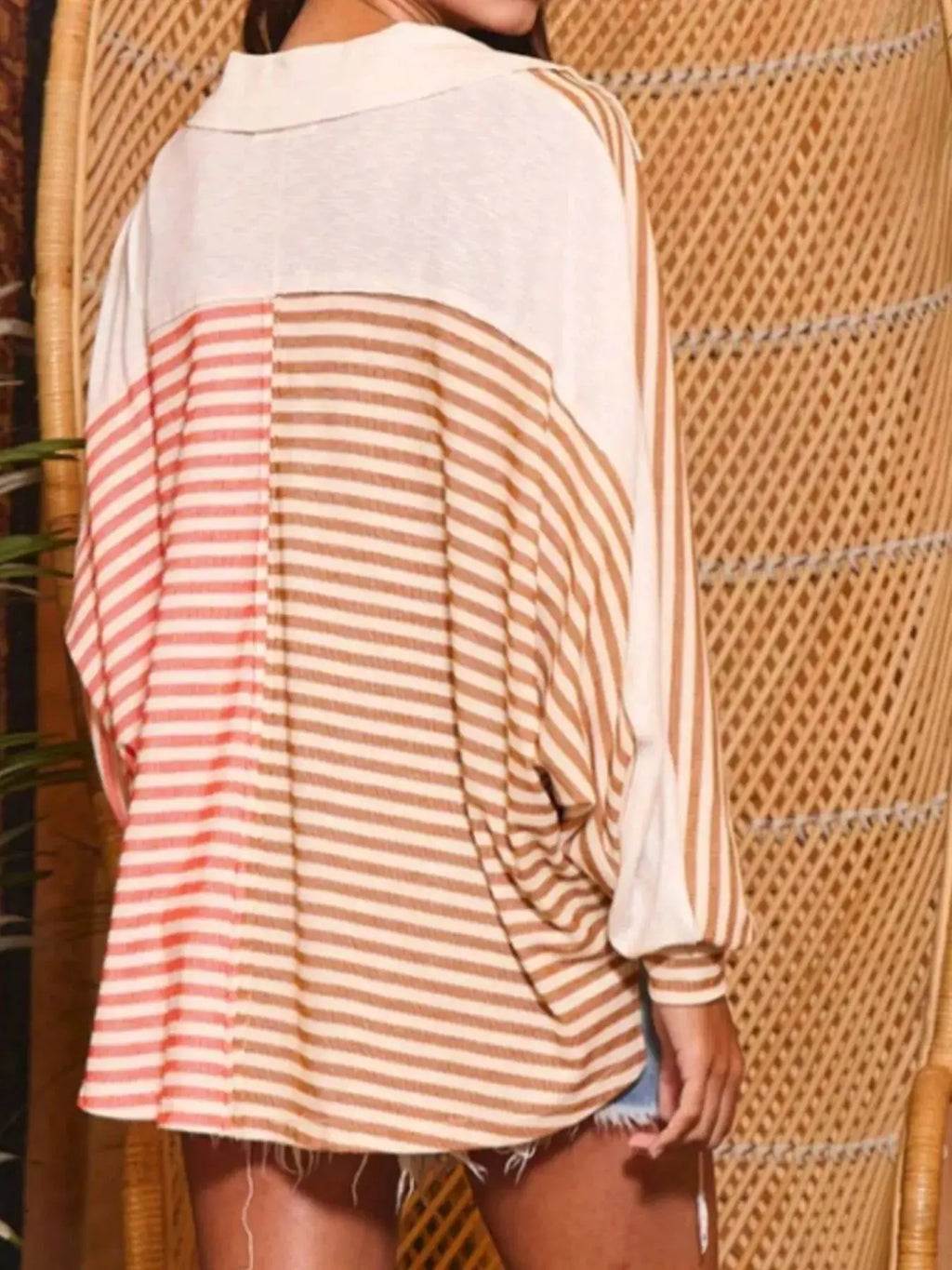 Striped oversized half-button sweatshirt with cream and tan horizontal stripes, long sleeves