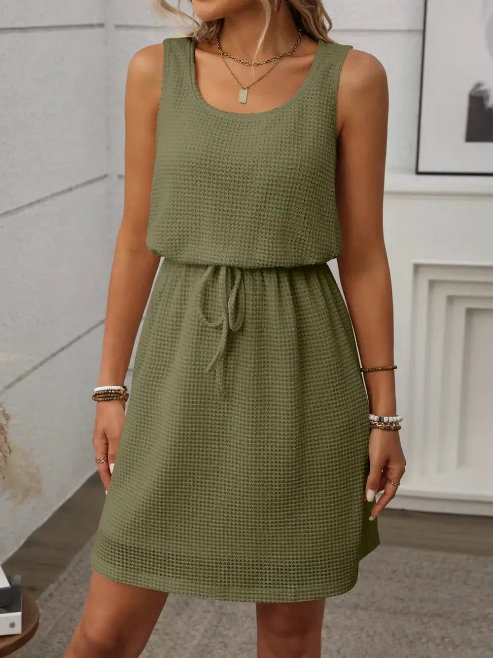 Waffle-Knit Drawstring Mini Tank Dress in olive green; sleeveless with waist drawstring and casual silhouette.