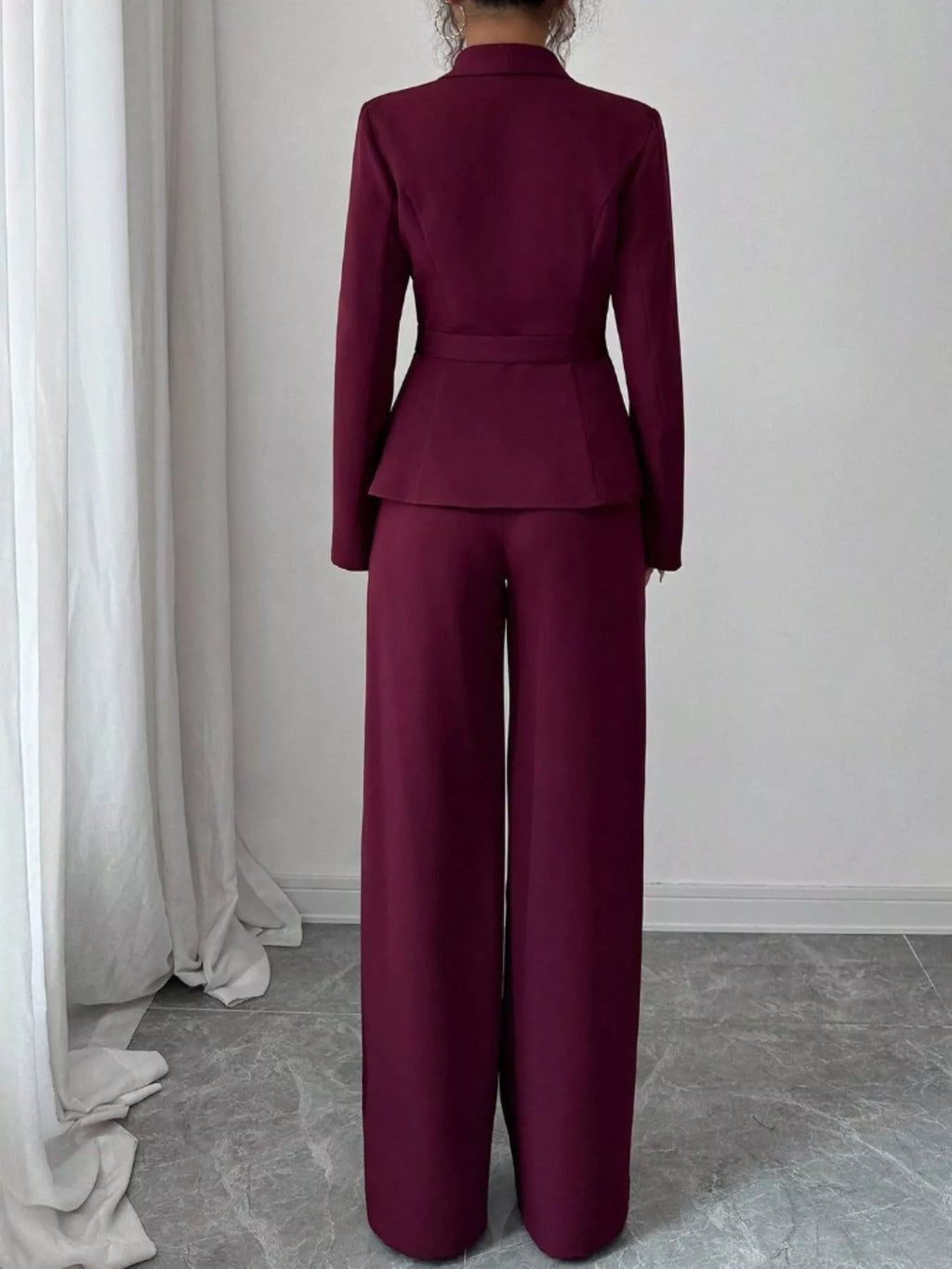 One Button Blazer and Pants Set by Belle Bijouix in burgundy; back view with peplum waist and wide-leg trousers.