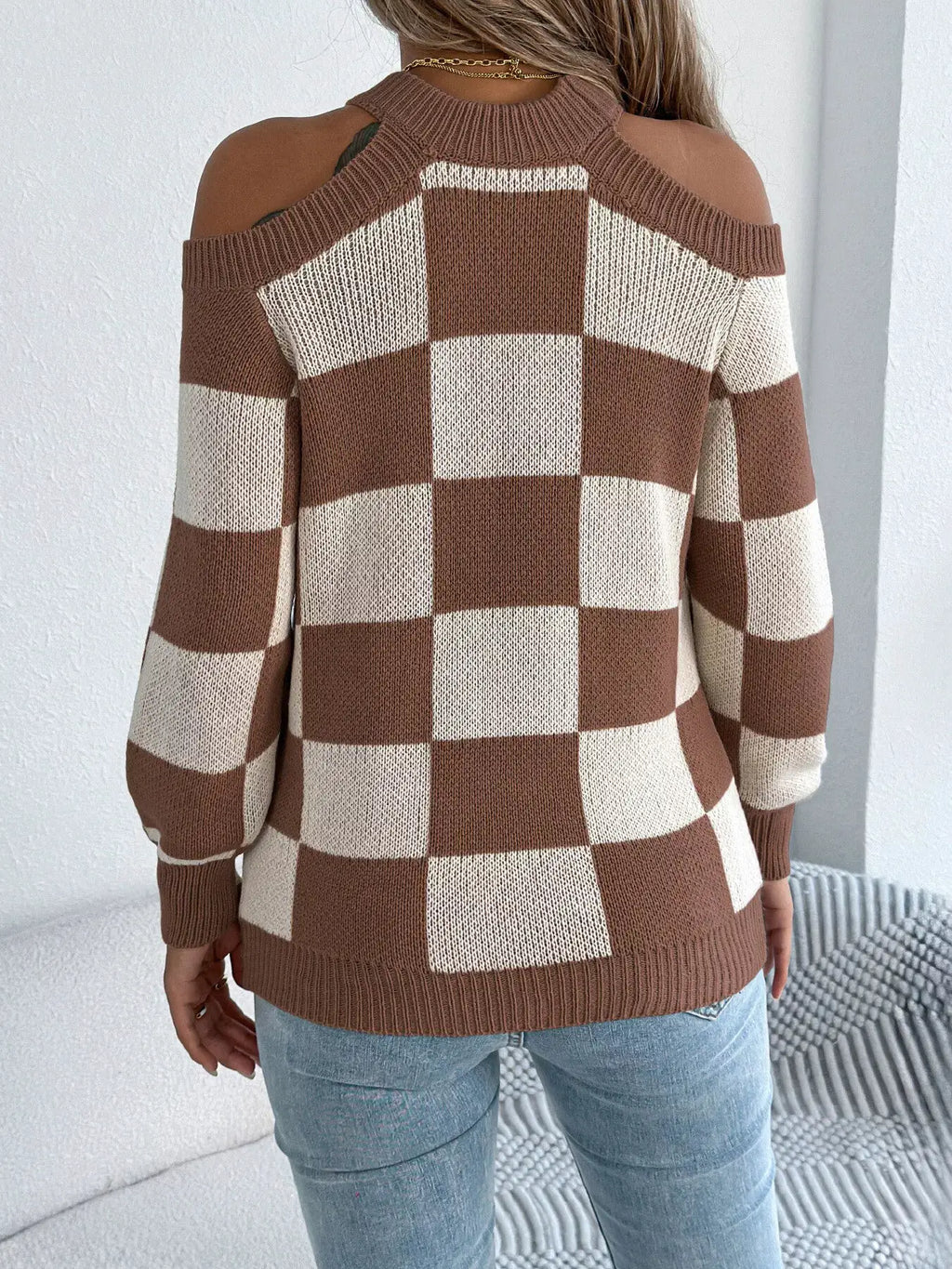 Cold shoulder checkered long sleeve sweater by Belle Bijouix in brown and cream knit.