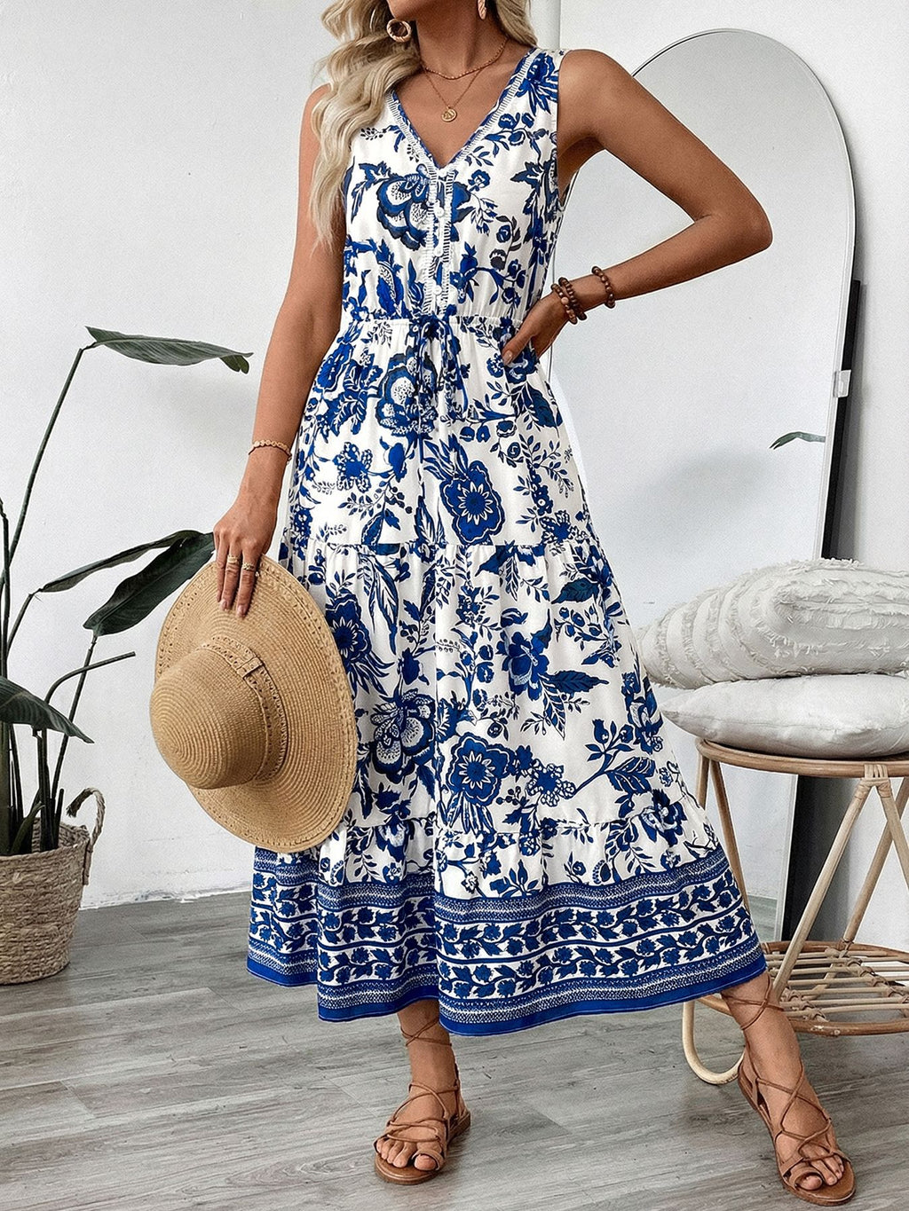 Bellebijouix floral print sleeveless V-neck midi dress, blue and white, with buttoned waist belt and tiered skirt