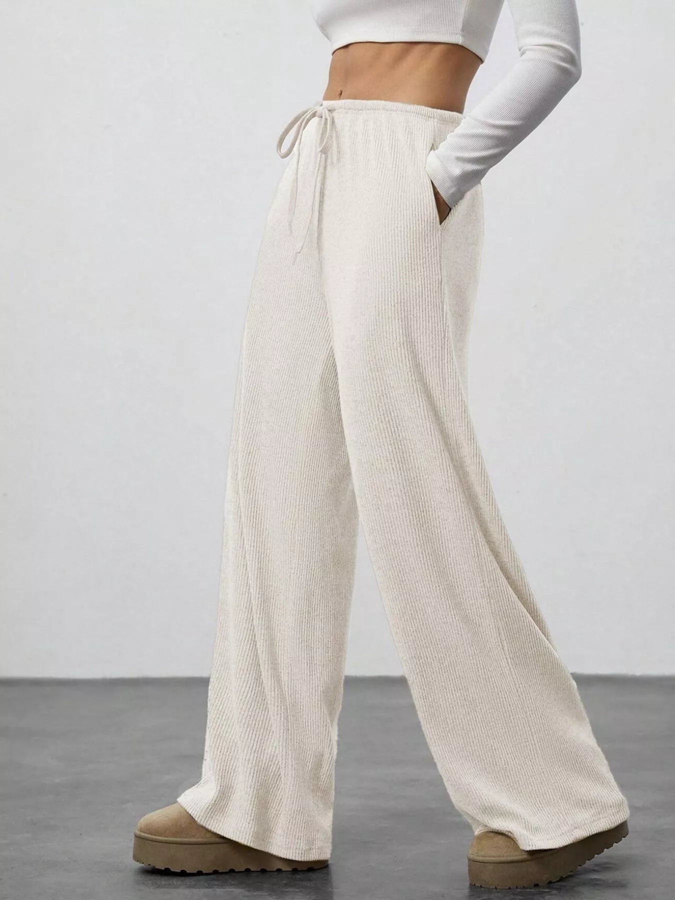 Relaxed Fit Drawstring Pants in cream with pockets, wide-leg jogger-style activewear
