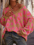 Leopard Oversized V-Neck Sweater by Belle Bijouix, pink leopard print on tan knit with a loose fit.