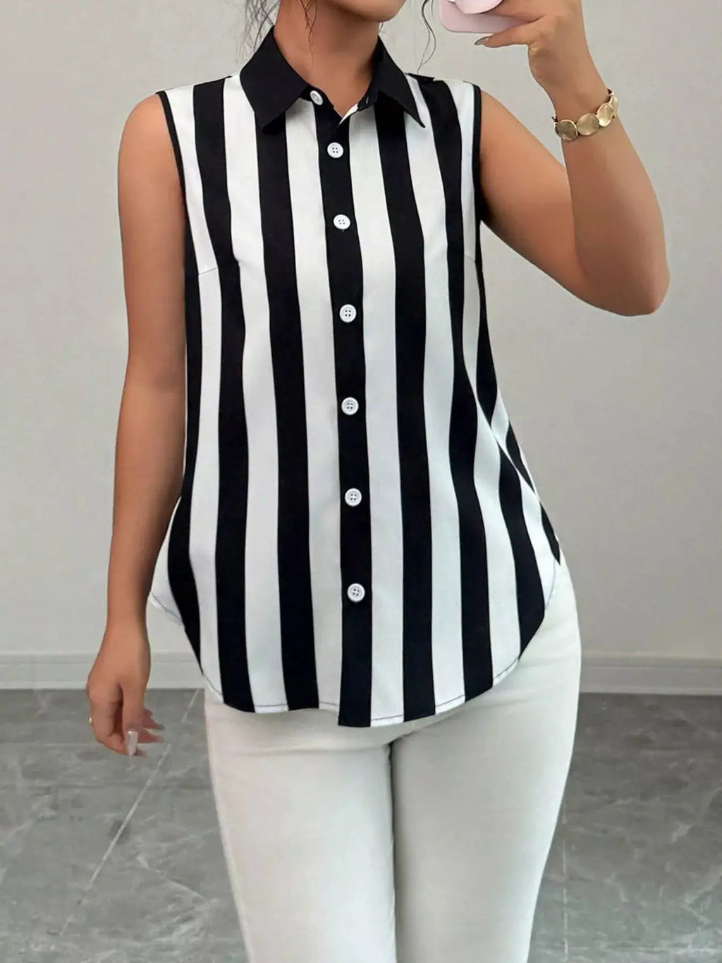 Button Up Sleeveless Shirt in black and white vertical stripes with front buttons