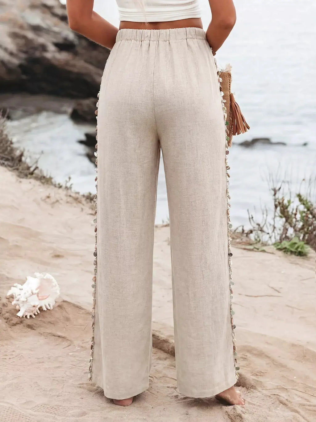 Drawstring wide-leg pants by Trendsi in beige linen-look fabric.