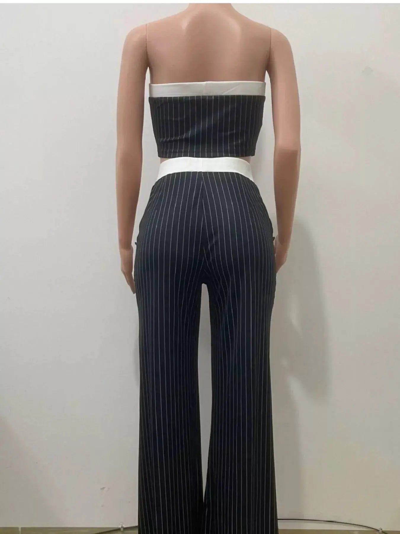 Striped strapless crop top and wide-leg pants set in navy with white pinstripes and white waistbands