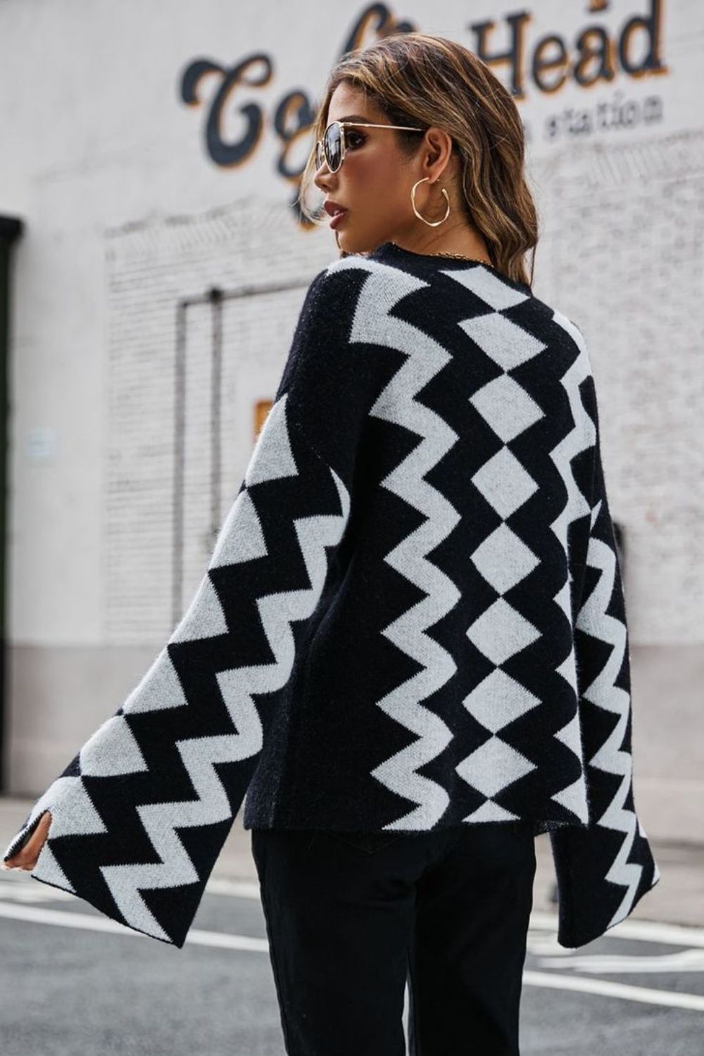Angel Wings Geometric Slit Flare Sleeve Round Neck Sweater in black and white knit