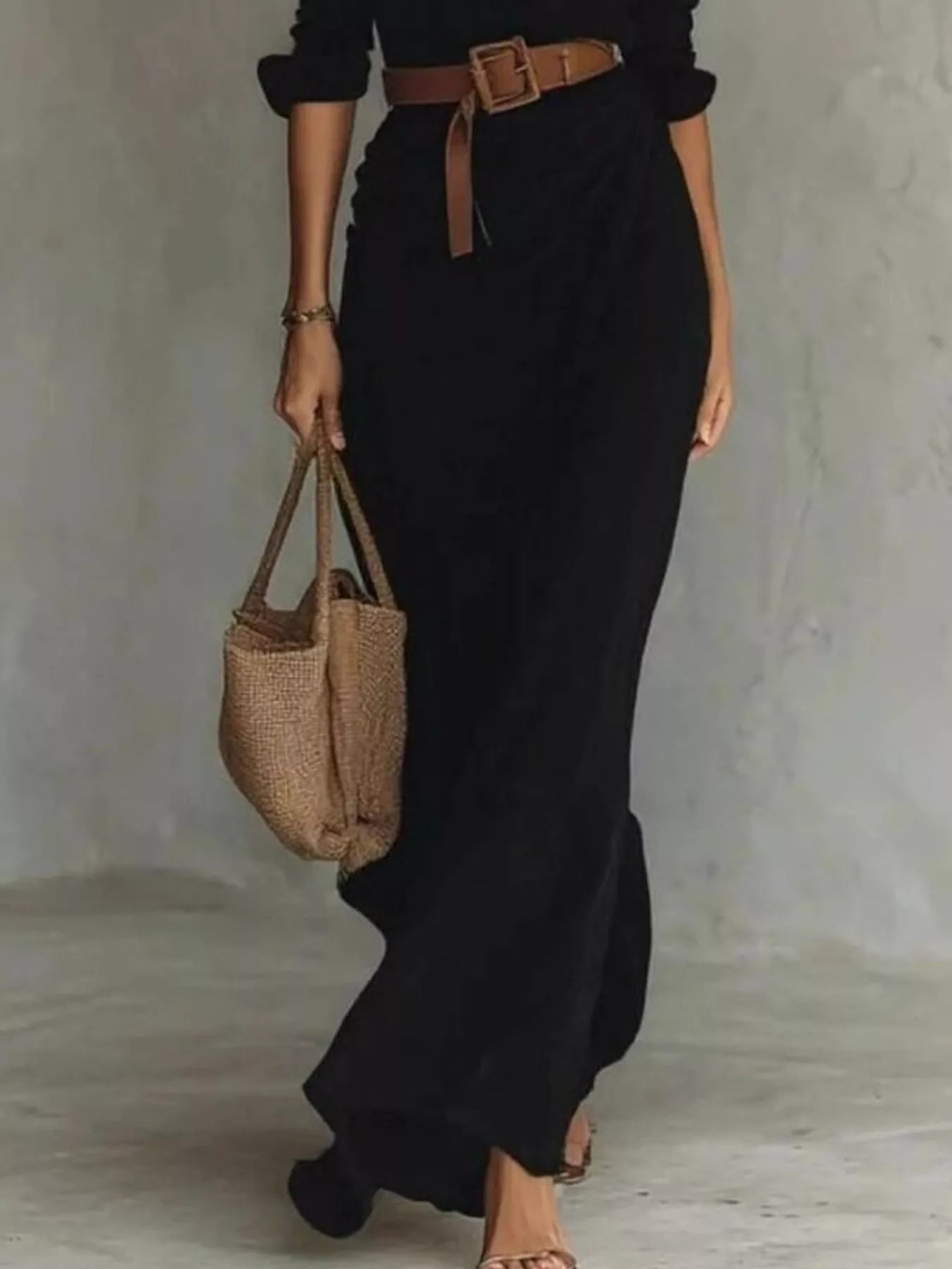 Full Size Ruched Long Sleeve Maxi Dress plus size in black with belted waist; shown with 1 tan woven bag