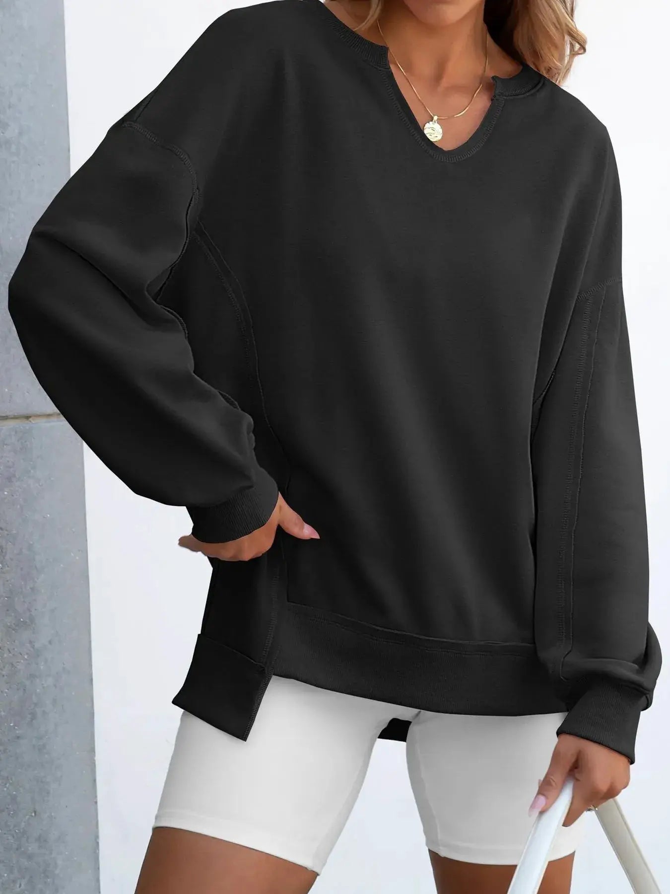 Notched long sleeve oversized sweatshirt top, black, loose fit.