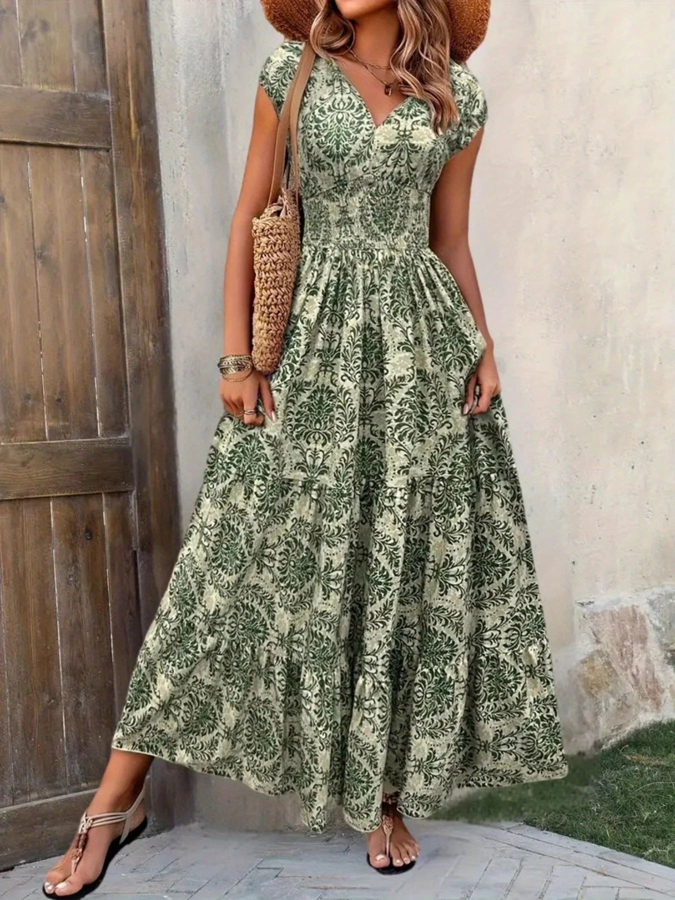 Printed cap sleeve maxi dress in green leafy print with tiered skirt and smocked bodice