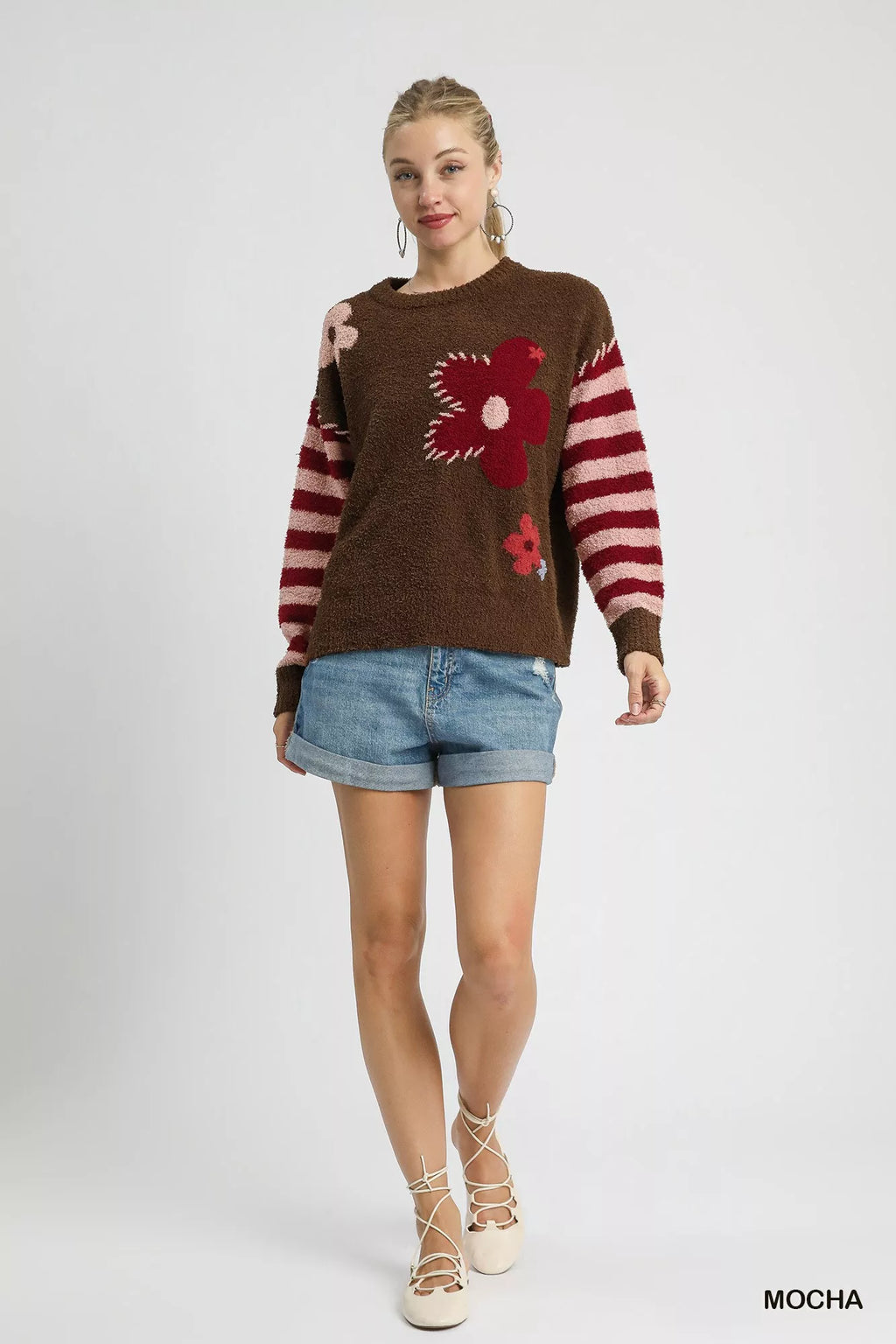 Top: Umgee Flower Jacquard Striped Long Sleeve Sweater in brown with red floral applique and pink striped sleeves