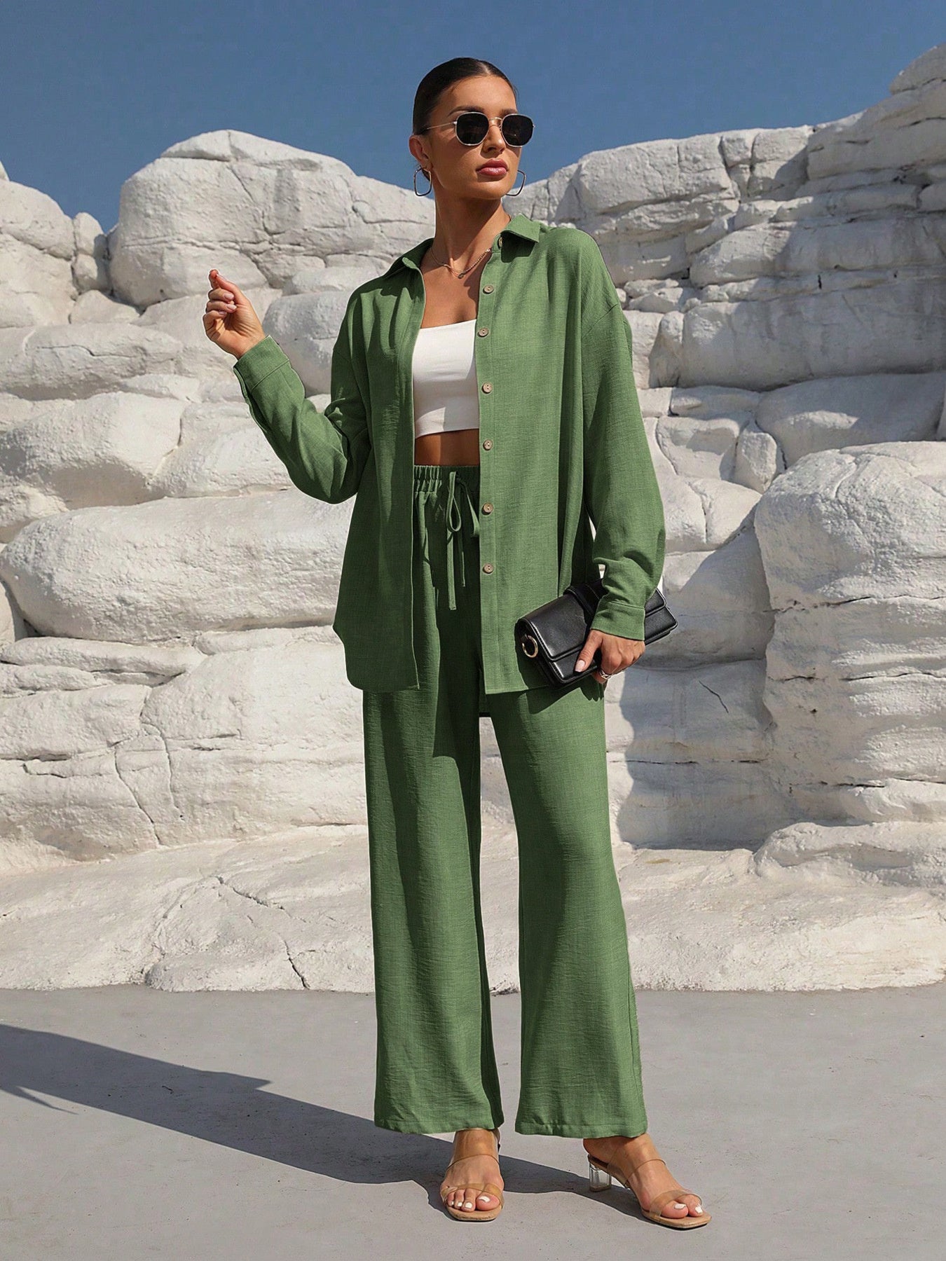 Button-up long-sleeve shirt and pants set in green by Trendsi, worn with a white crop top