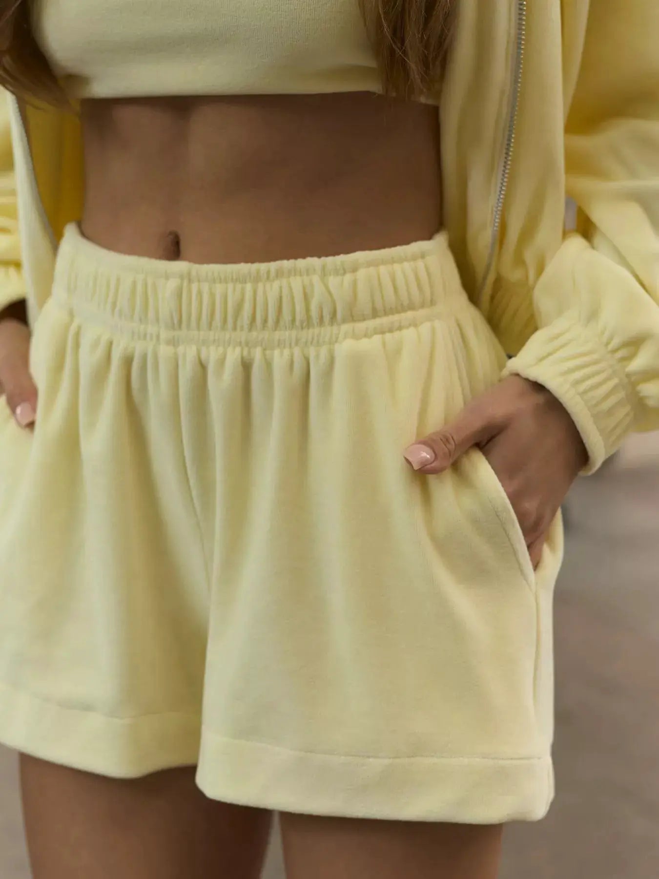 Zip-Up Cropped Hoodie and Shorts Set in pale yellow by Belle Bijouix; two-piece activewear
