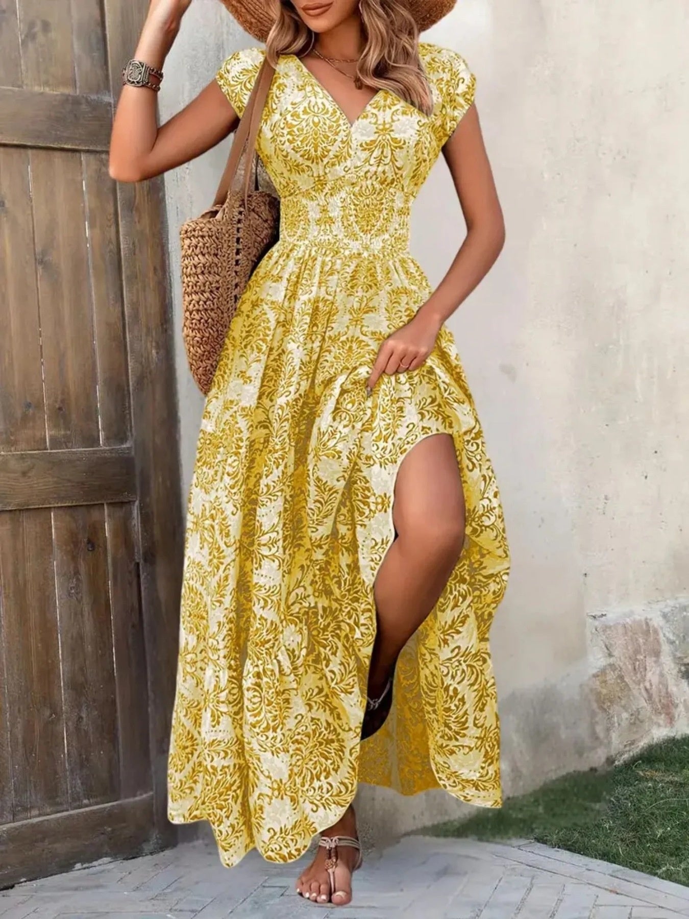 Printed cap sleeve maxi dress in yellow damask print; smocked waist, tiered skirt.