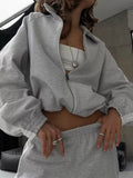 Two-Piece Zip-Up Long Sleeve Outerwear and Pants Set in light gray by Belle Bijouix; zip hoodie with matching joggers.