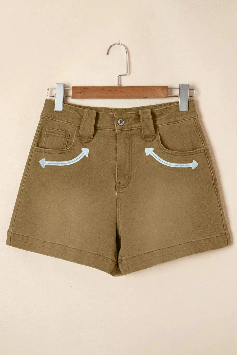 Women's western denim shorts in khaki with light blue contrast arrow embroidery on front pockets.