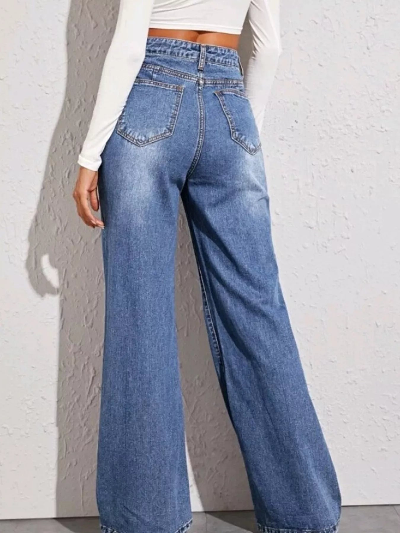 High-Waisted Wide-Leg Jeans in blue denim with back pockets