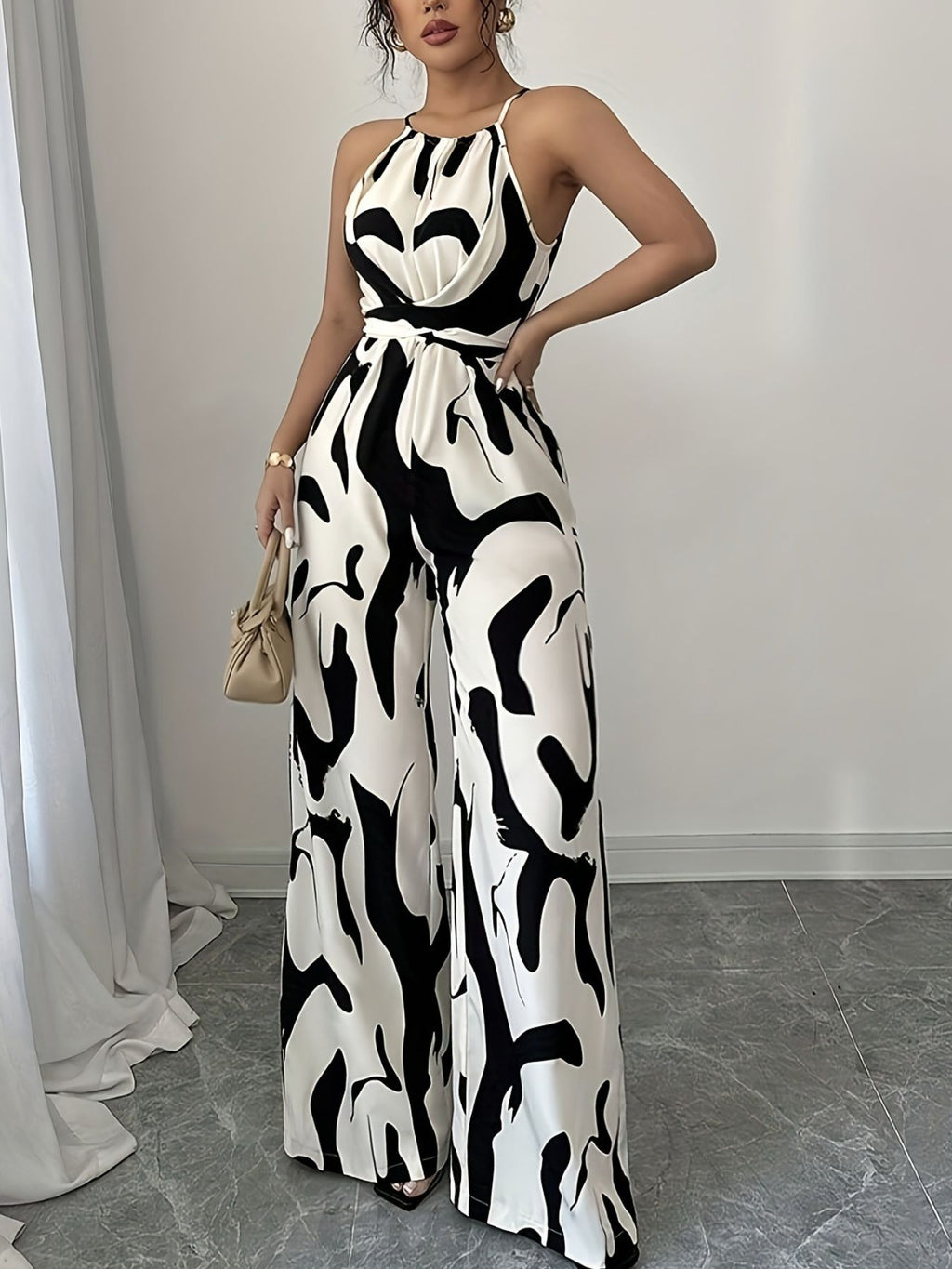 Abstract print sleeveless wide-leg jumpsuit by Bellebijouix with waist belt