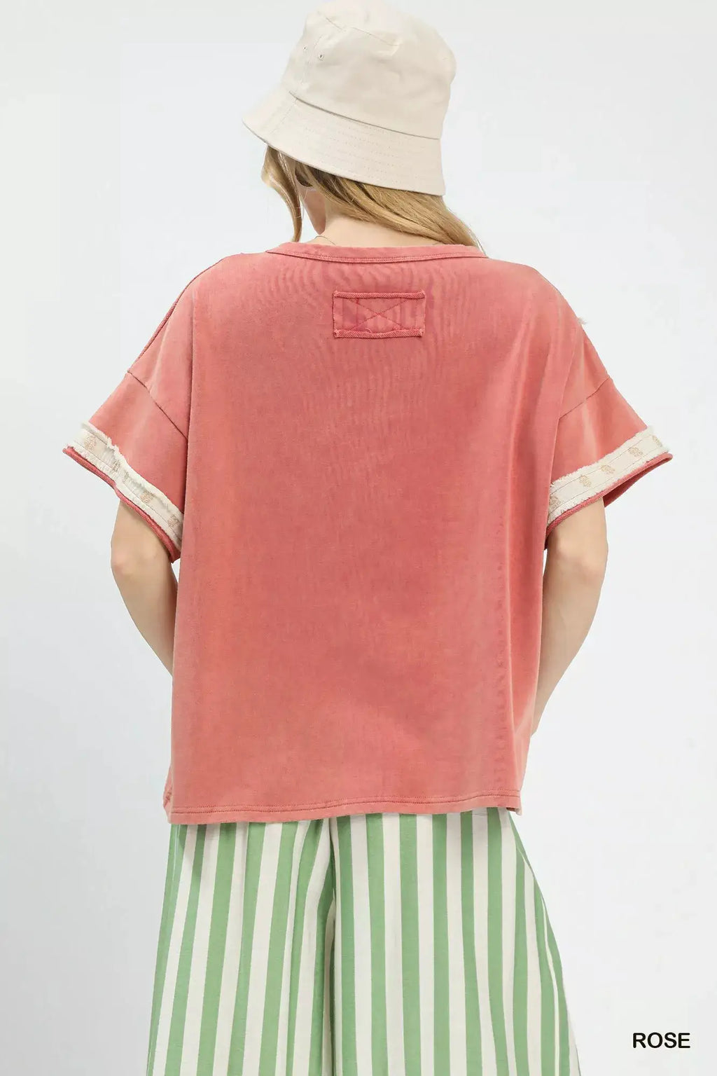 Umgee French Terry Top with Flower Patch in rose pink; back patch detail with rolled sleeves.