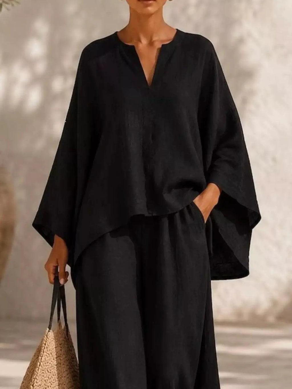 Plus Size Notched Long Sleeve Top & Wide Leg Pants Set, black two-piece outfit with a loose, flowy top.
