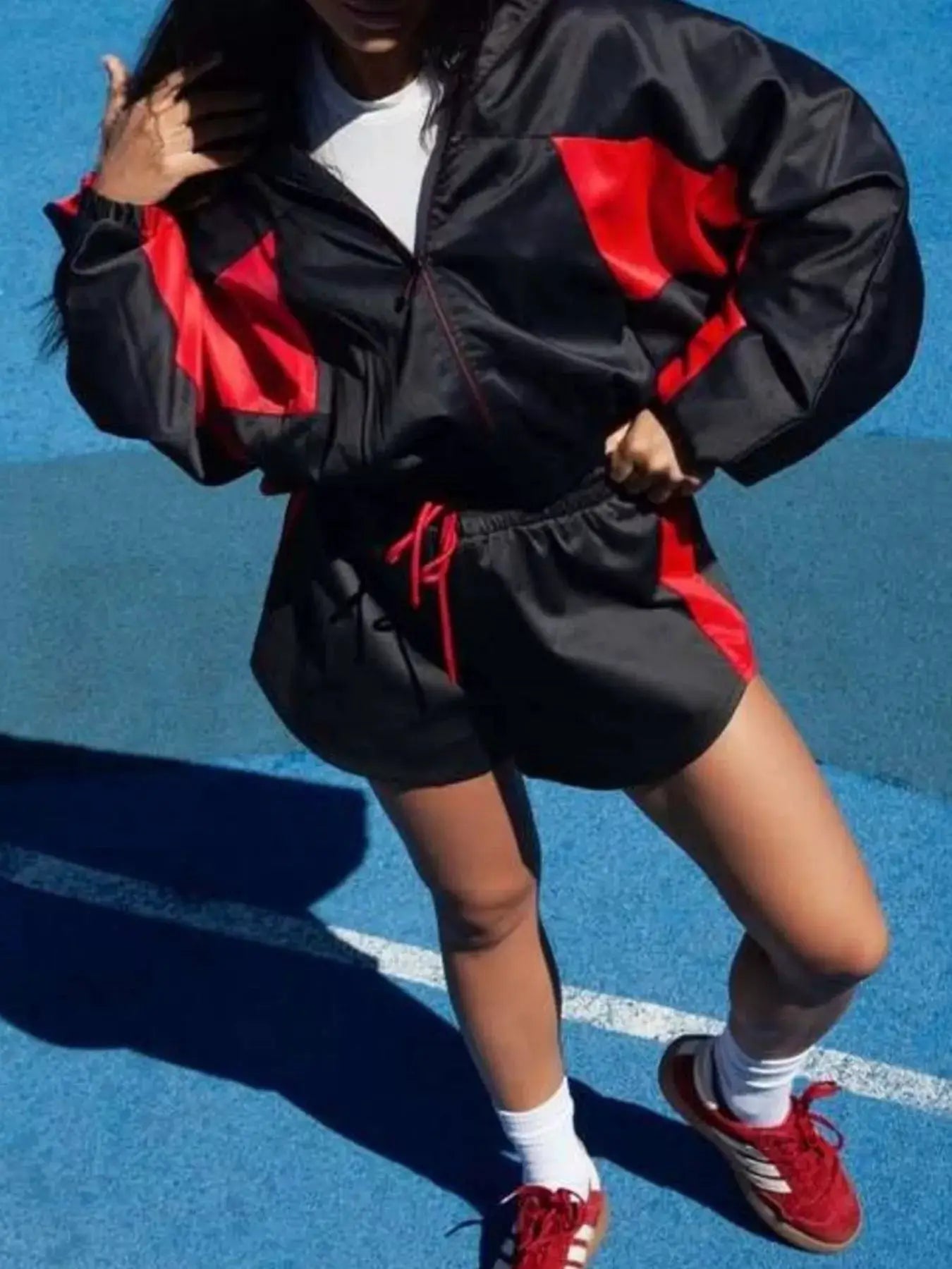 Zip-Up Long Sleeve Top & Shorts Set in black with red color-block panels, two-piece active wear