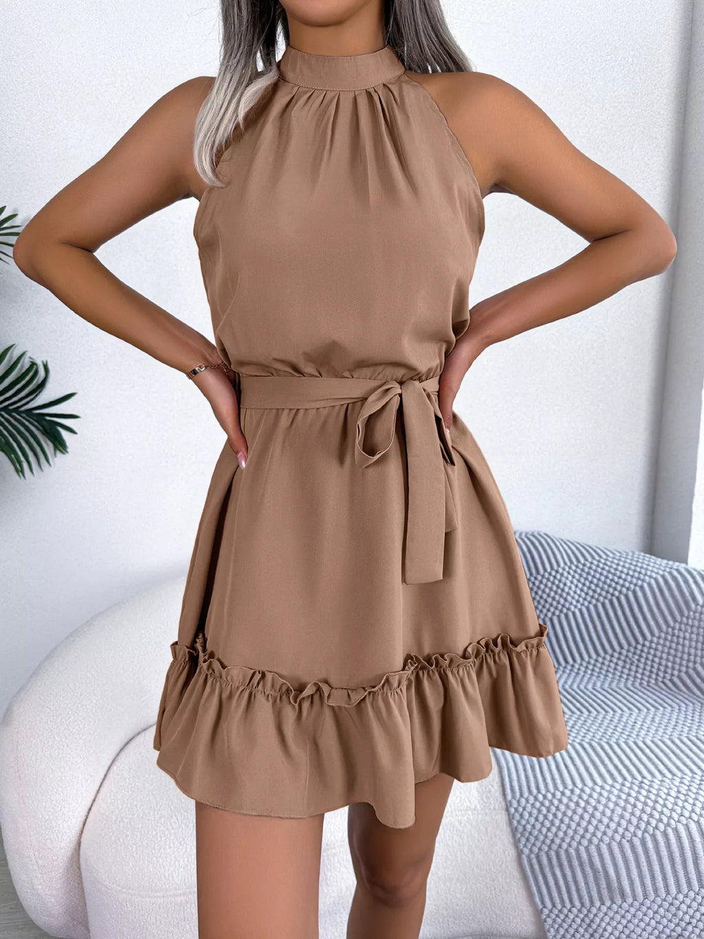 Belle Bijouix halter-neck A-line dress with belted waist and ruffled hem in tan