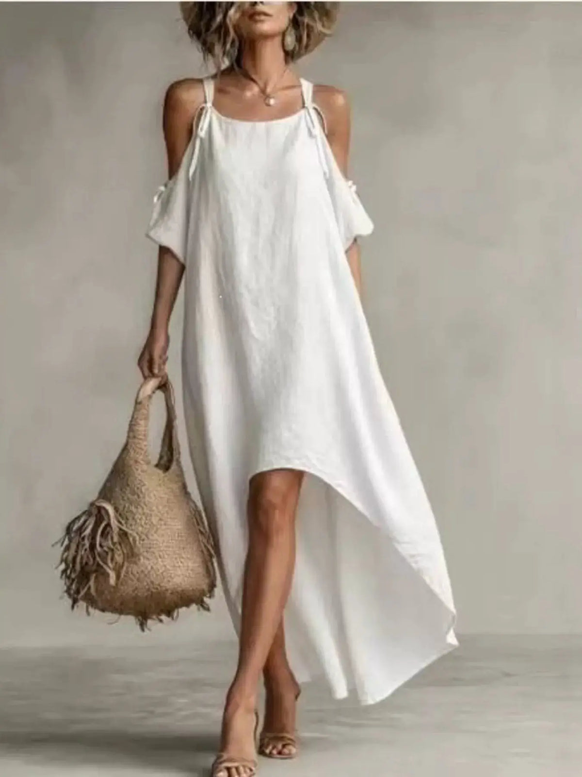 High-Low Cold Shoulder Maxi Dress in white with thin straps and a flowing silhouette
