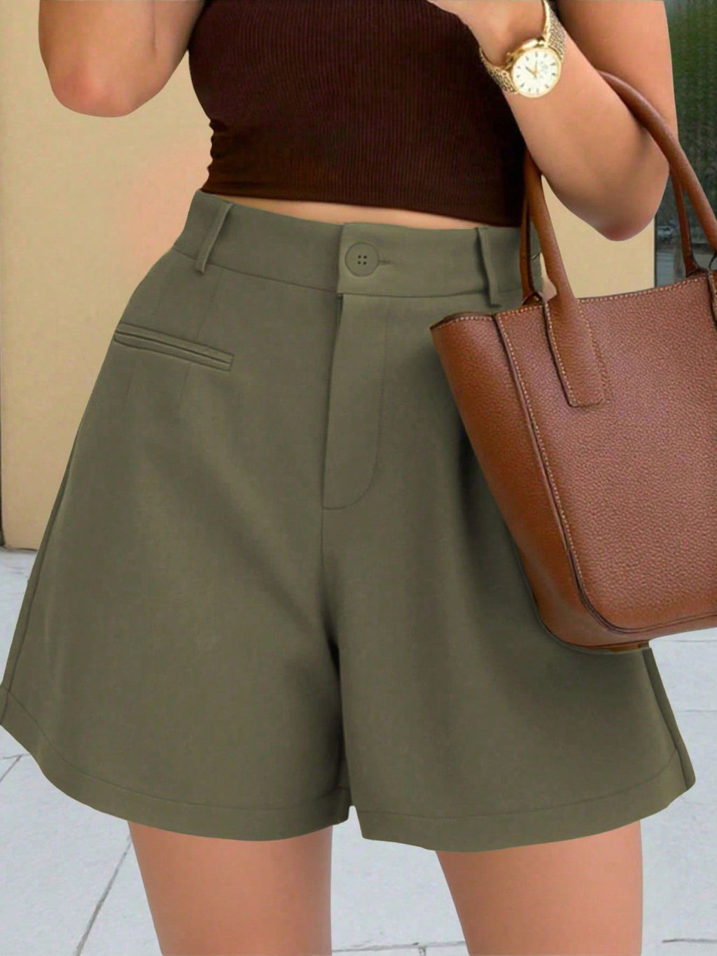 High-Waisted shorts in olive green with button waist and front welt pockets.