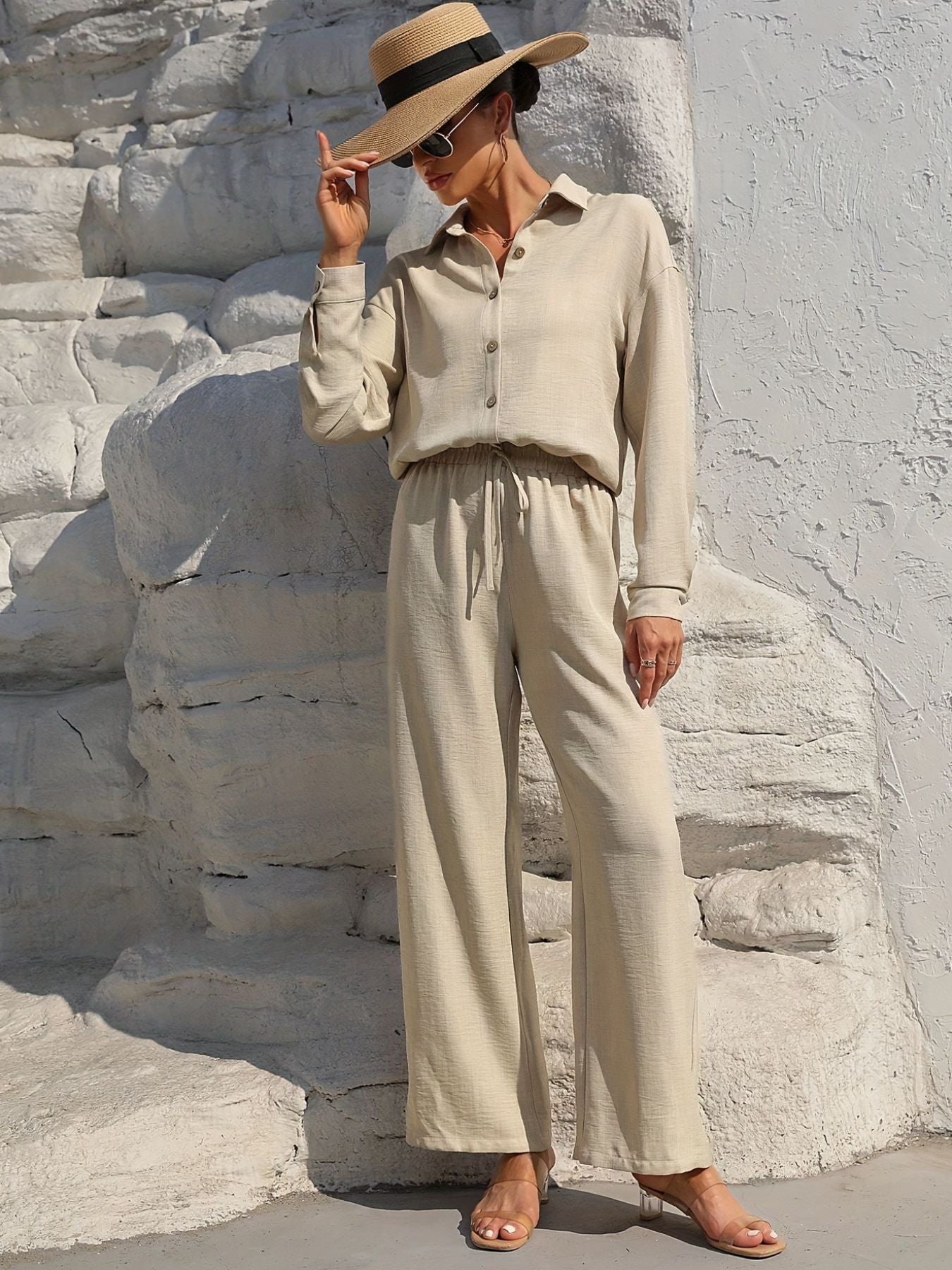 Button Up Long Sleeve Shirt and Pants Set in beige; model wearing straw hat and sunglasses